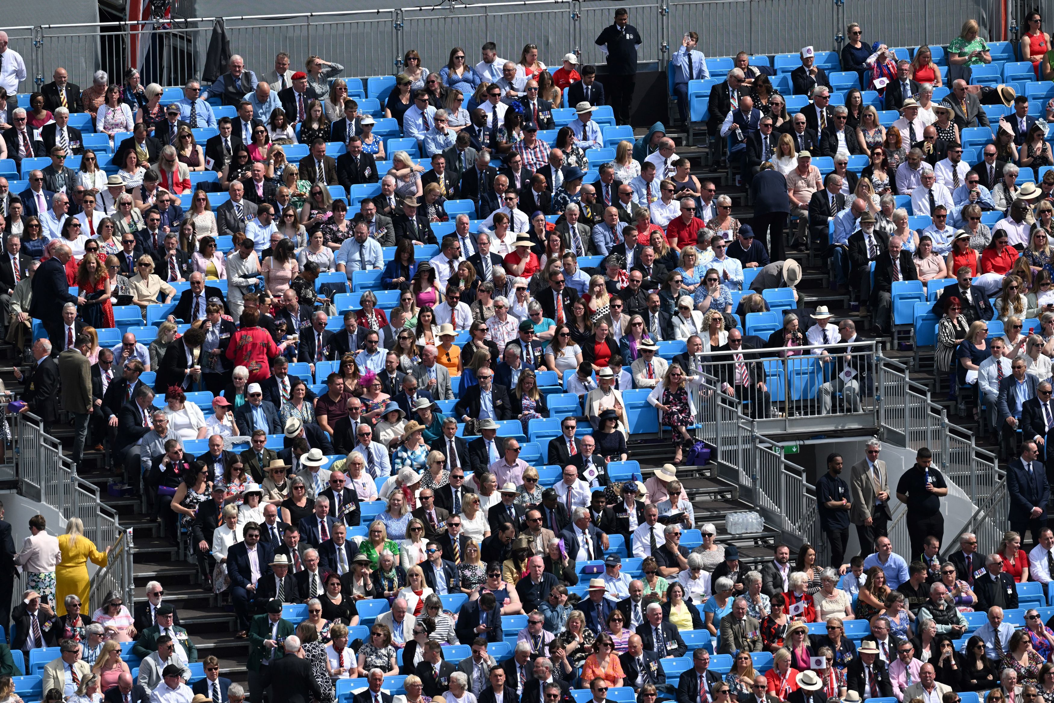 Members of the public in the stands watching the parade