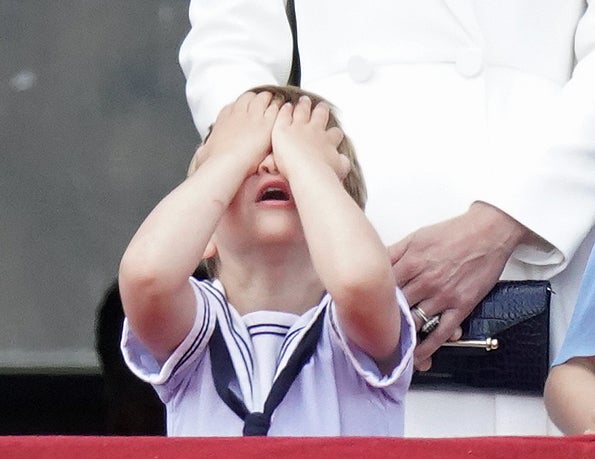 Prince Louis reacts on the balcony of Buckingham Palace