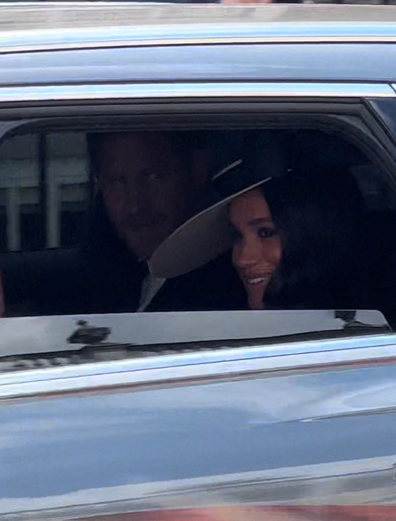 Prince Harry and Meghan Markle pictured in a car during Platinum Jubilee celebrations