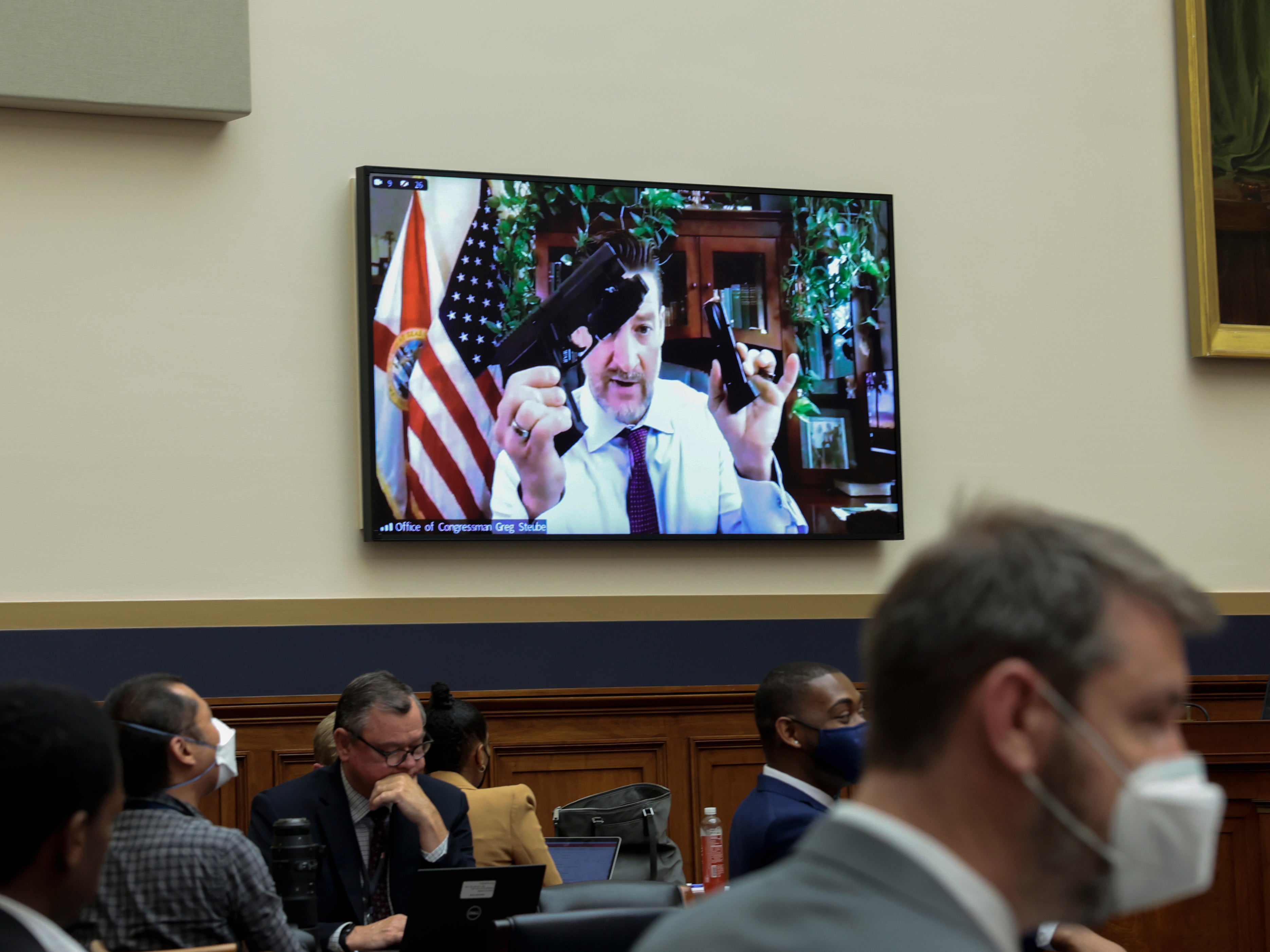 Rep. Greg Steube (R-FL) demonstrates assembling his handgun as he speaks remotely during a House Judiciary Committee mark up hearing in the Rayburn House Office Building on June 02, 2022 in Washington, DC