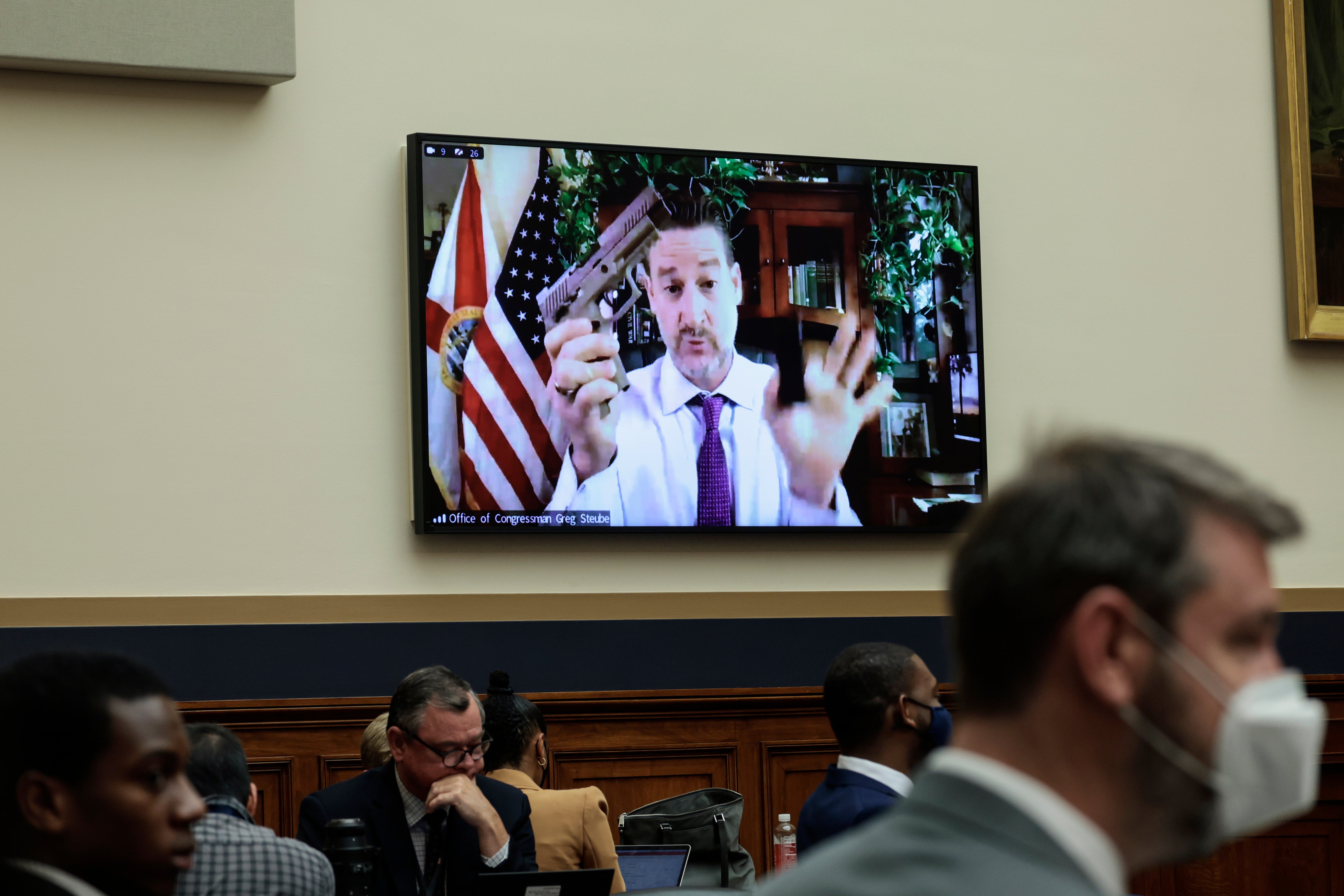 Rep. Greg Steube (R-FL) demonstrates assembling his handgun as he speaks remotely during a House Judiciary Committee mark up hearing in the Rayburn House Office Building on June 02, 2022 in Washington, DC