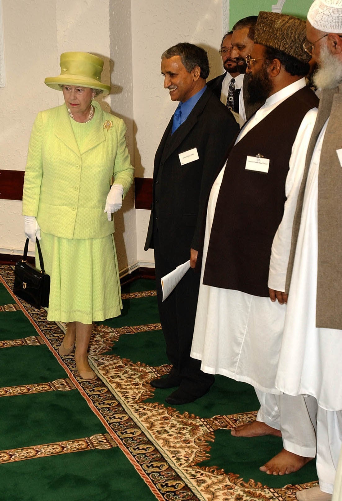 Queen Elizabeth II enters the Islamic Centre in Scunthorpe, the first visit by the Queen to a mosque in the UK