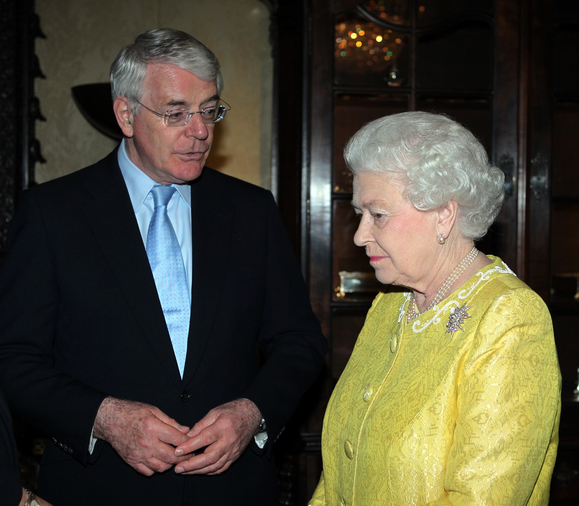 John Major, prime minister from 1990-1997, and the Queen in 2012