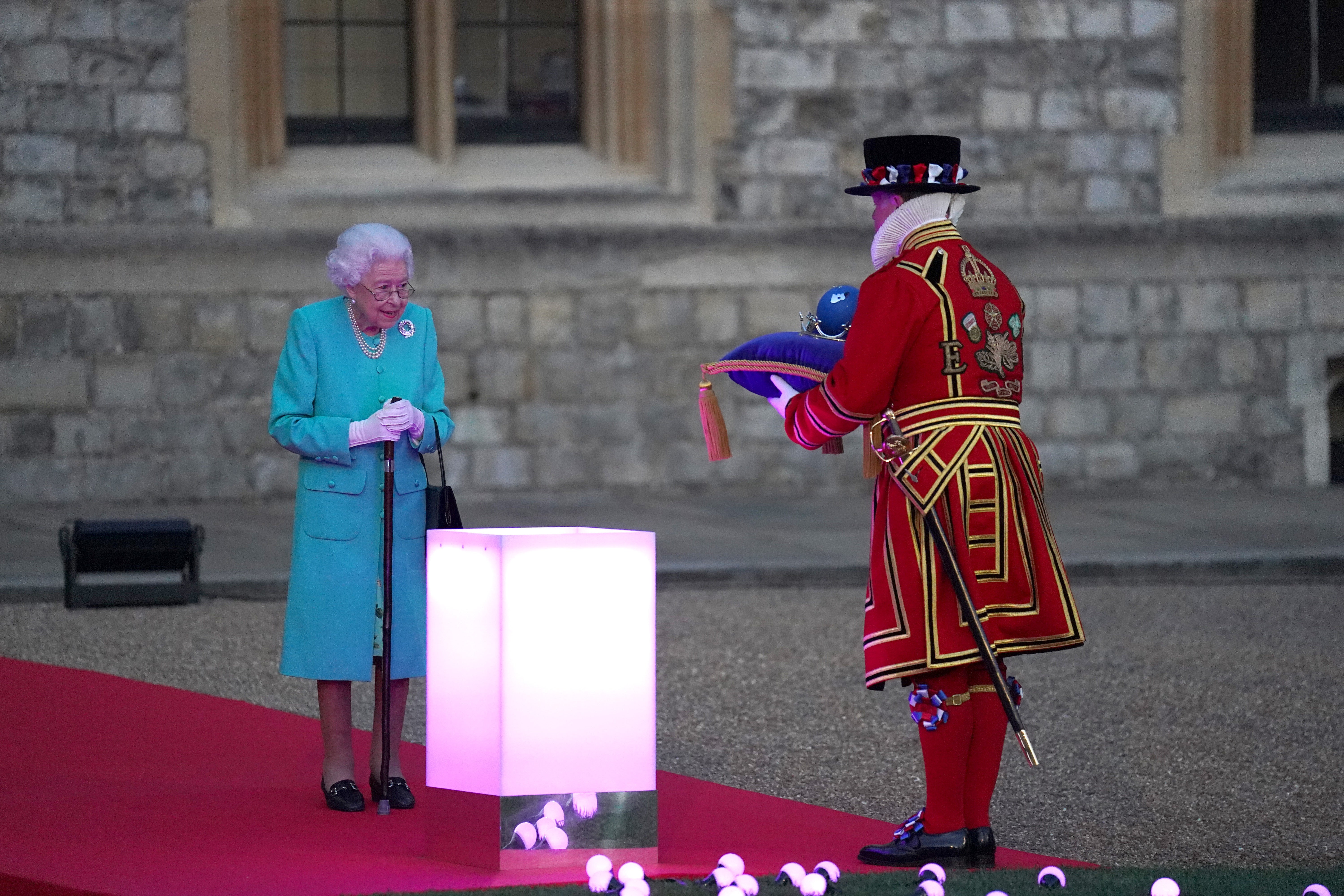 The Queen has symbolically led the lighting of the principal Platinum Jubilee beacon in a spectacular end to the first day of historic national commemorations celebrating her 70-year-reign (Steve Parsons/PA)