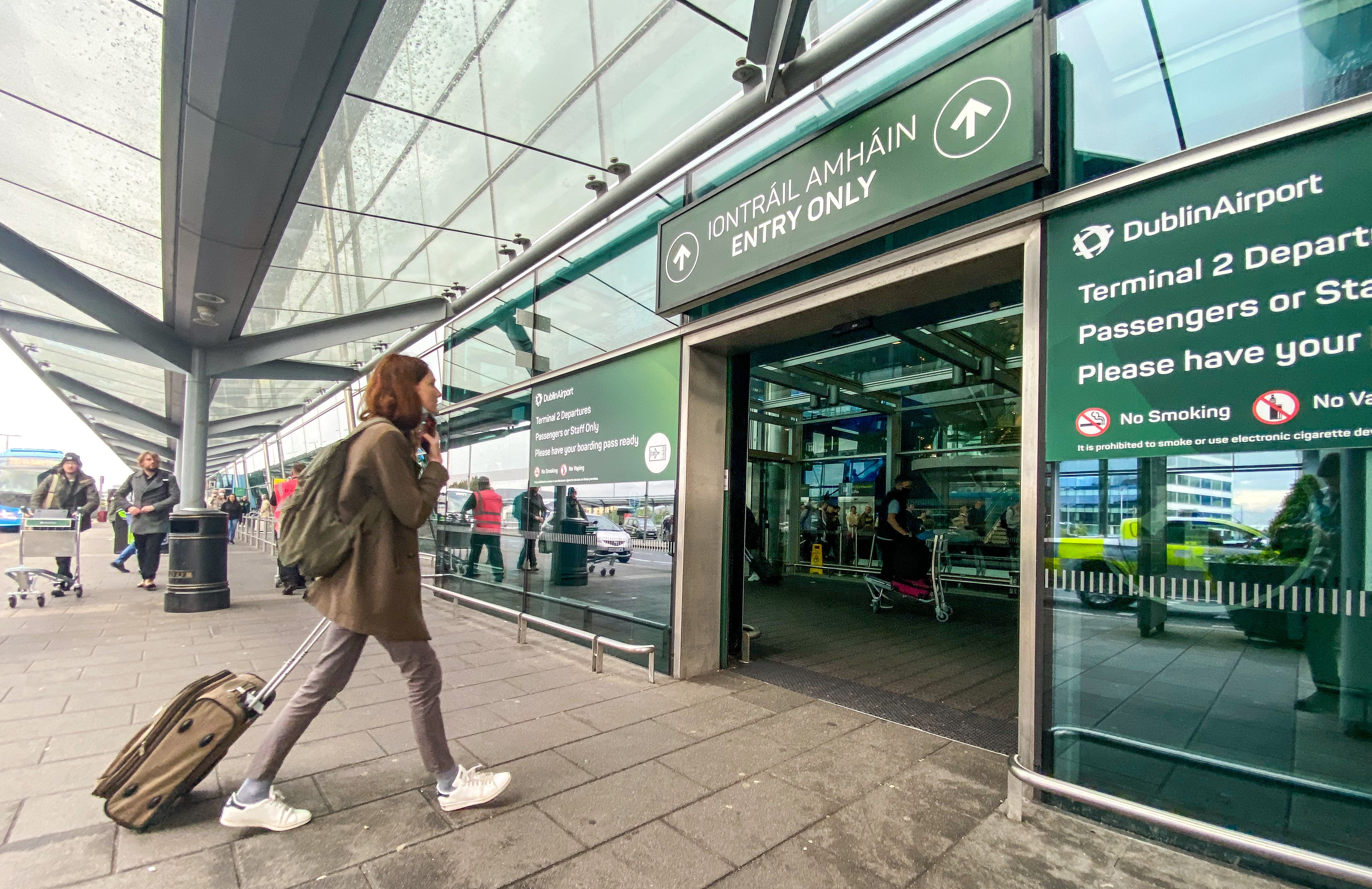 Passengers arrive at Dublin airport on Friday morning as around 200,000 people are set to travel through the airport over the bank holiday weekend (Damien Storan/PA)