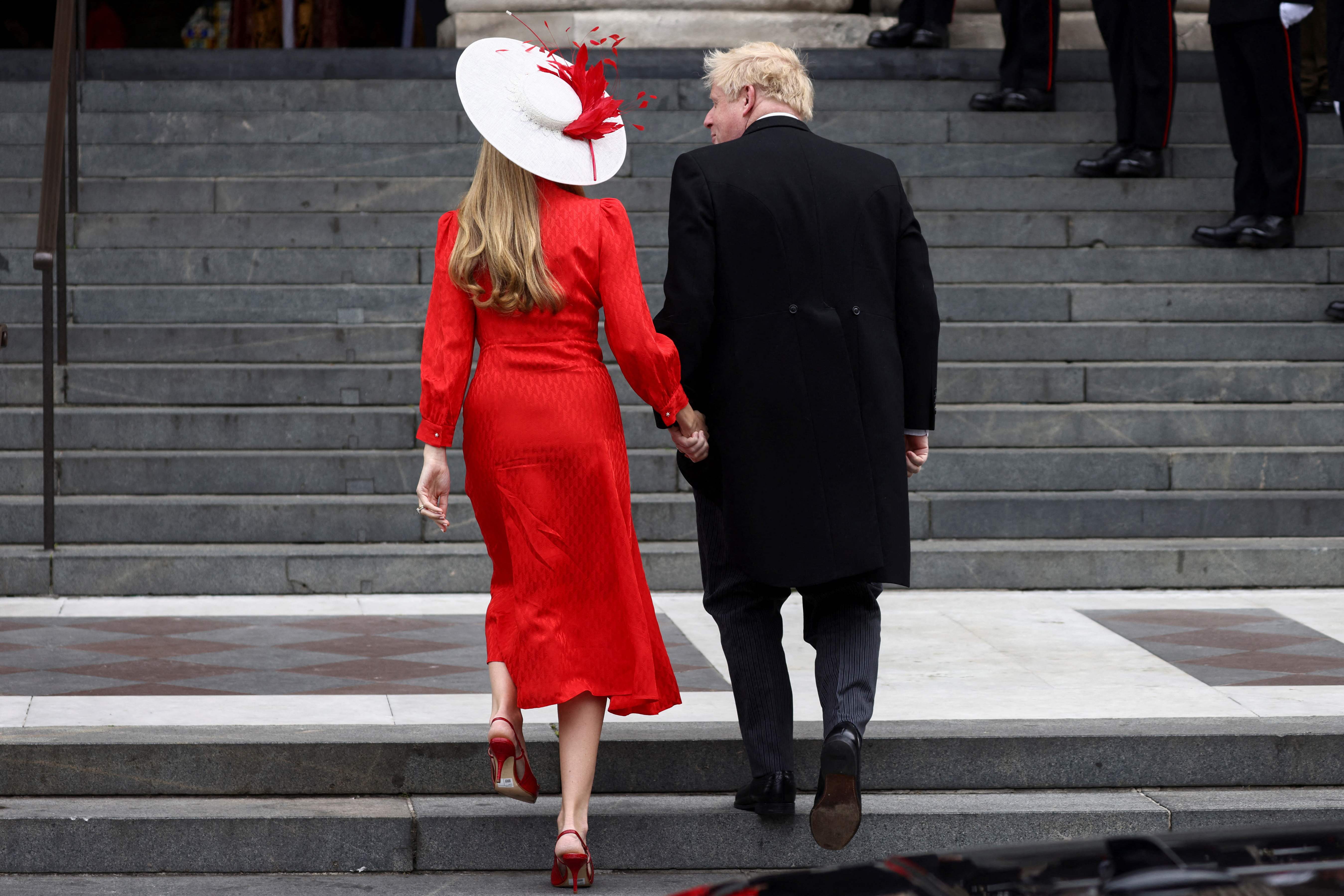 The couple pictured arriving at the service.