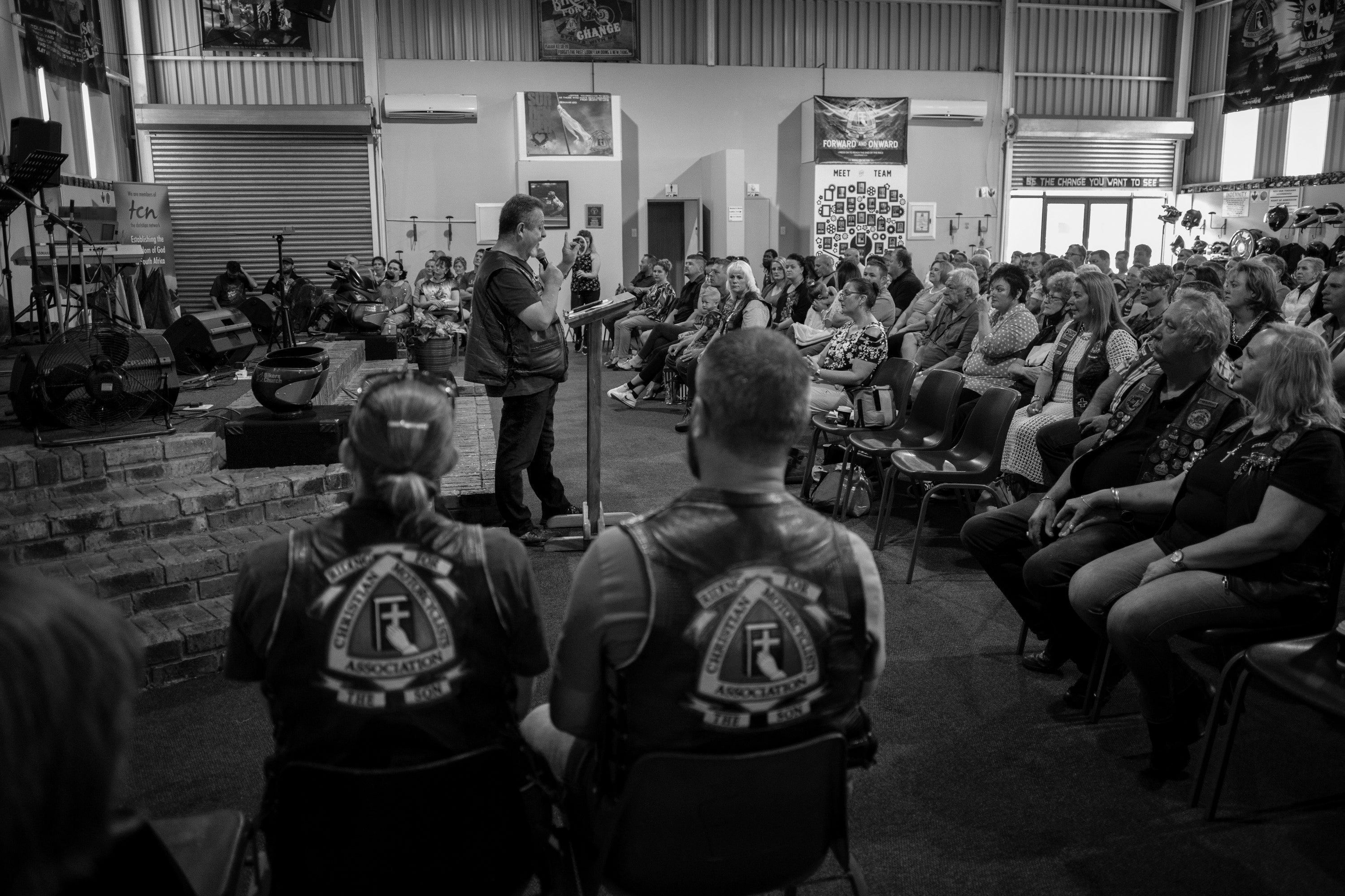 Members of the CMA Midvaal chapter listen to a sermon from a chapter member at their biker church in Vereeniging