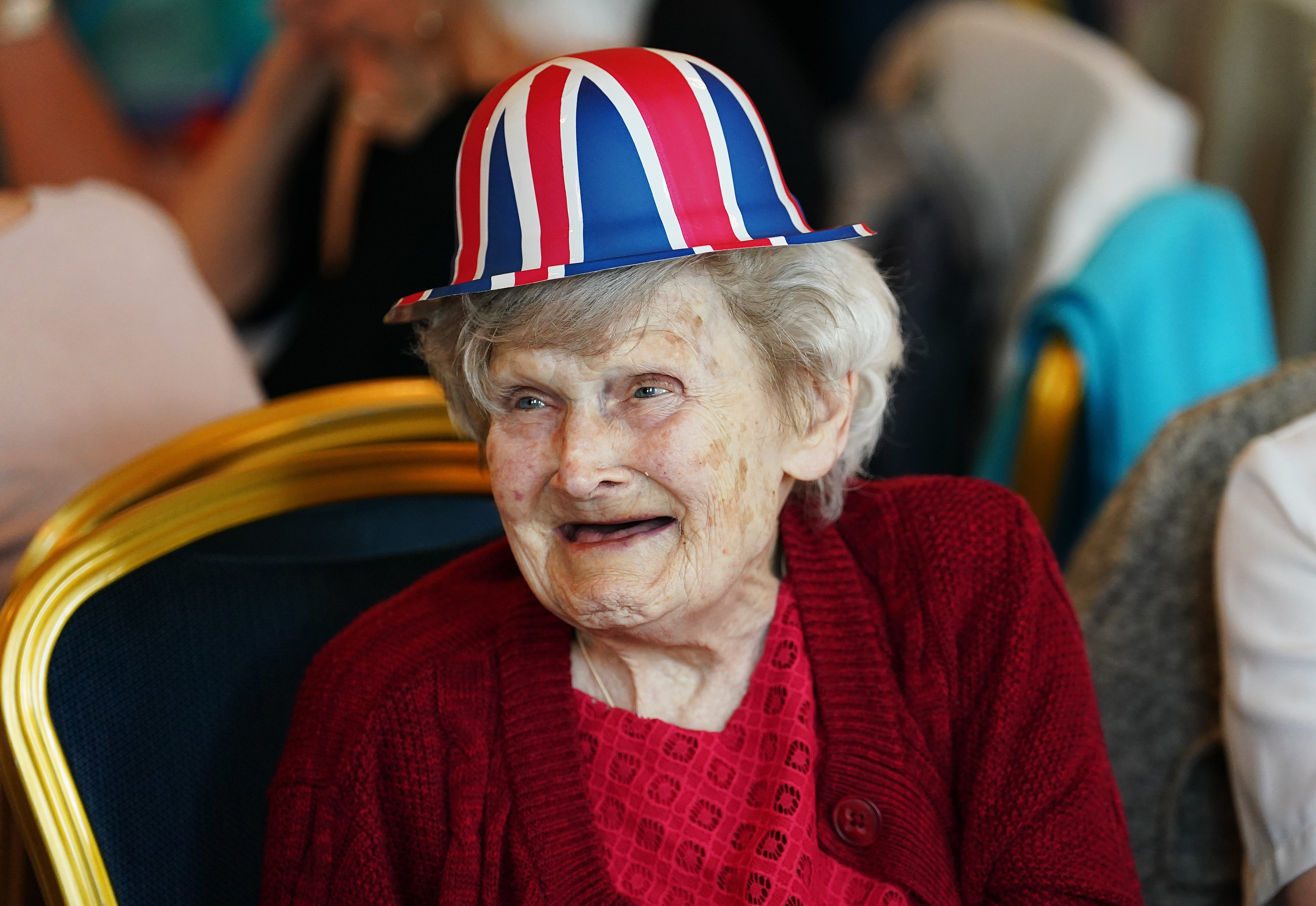 An elderly woman attends a Queen’s Platinum Jubilee tea dance at Belfast City Hall (Brian Lawless/PA)