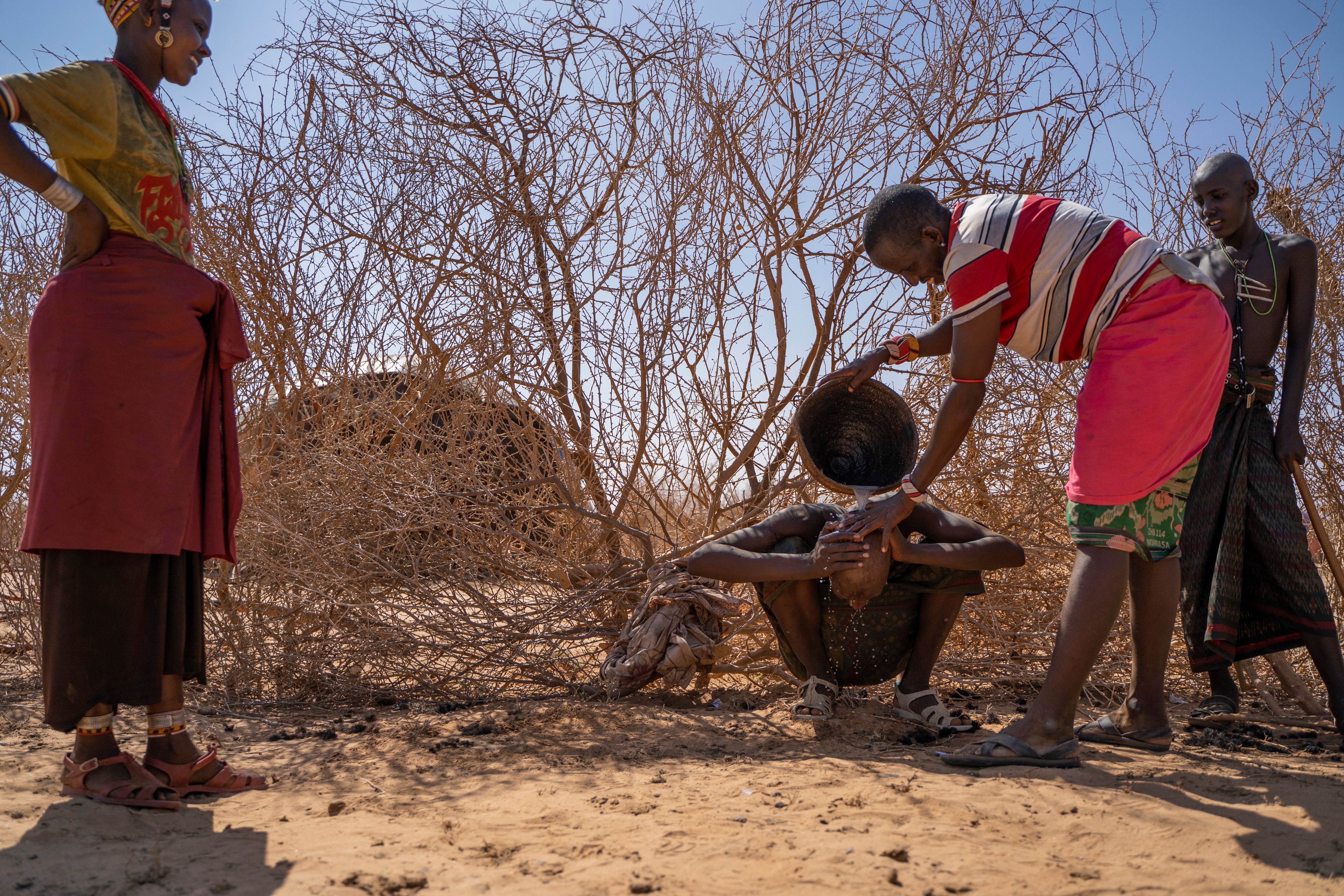 Head-shaving in the camel pen the day before circumcision