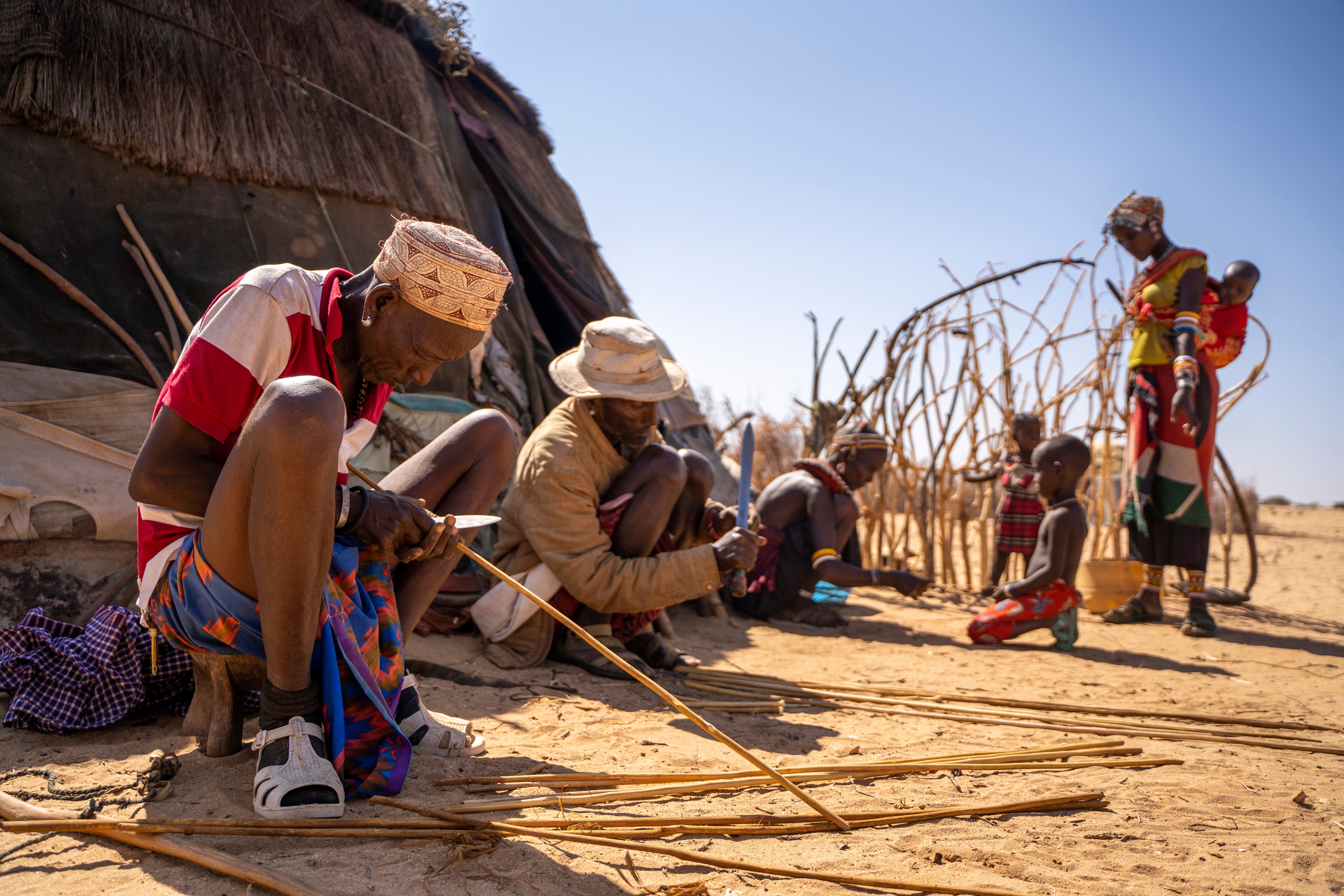 Elders make bows and arrows for the final month of ‘khandi’