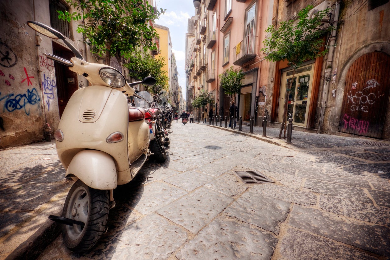 Graffiti and Vespas in the old streets of Naples