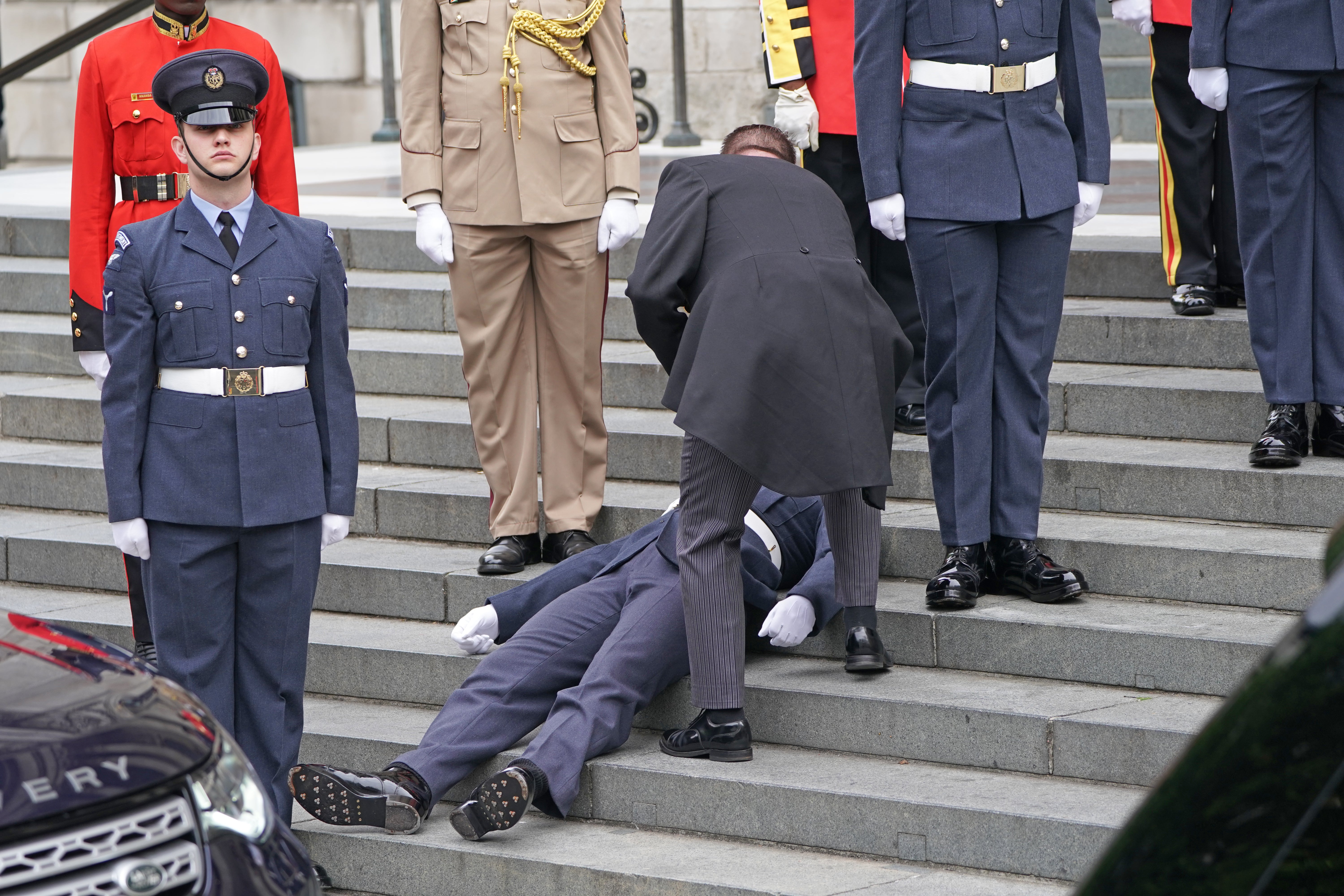 A military serviceman faints at St Paul’s Cathedral (Kirsty O’Connor/PA)