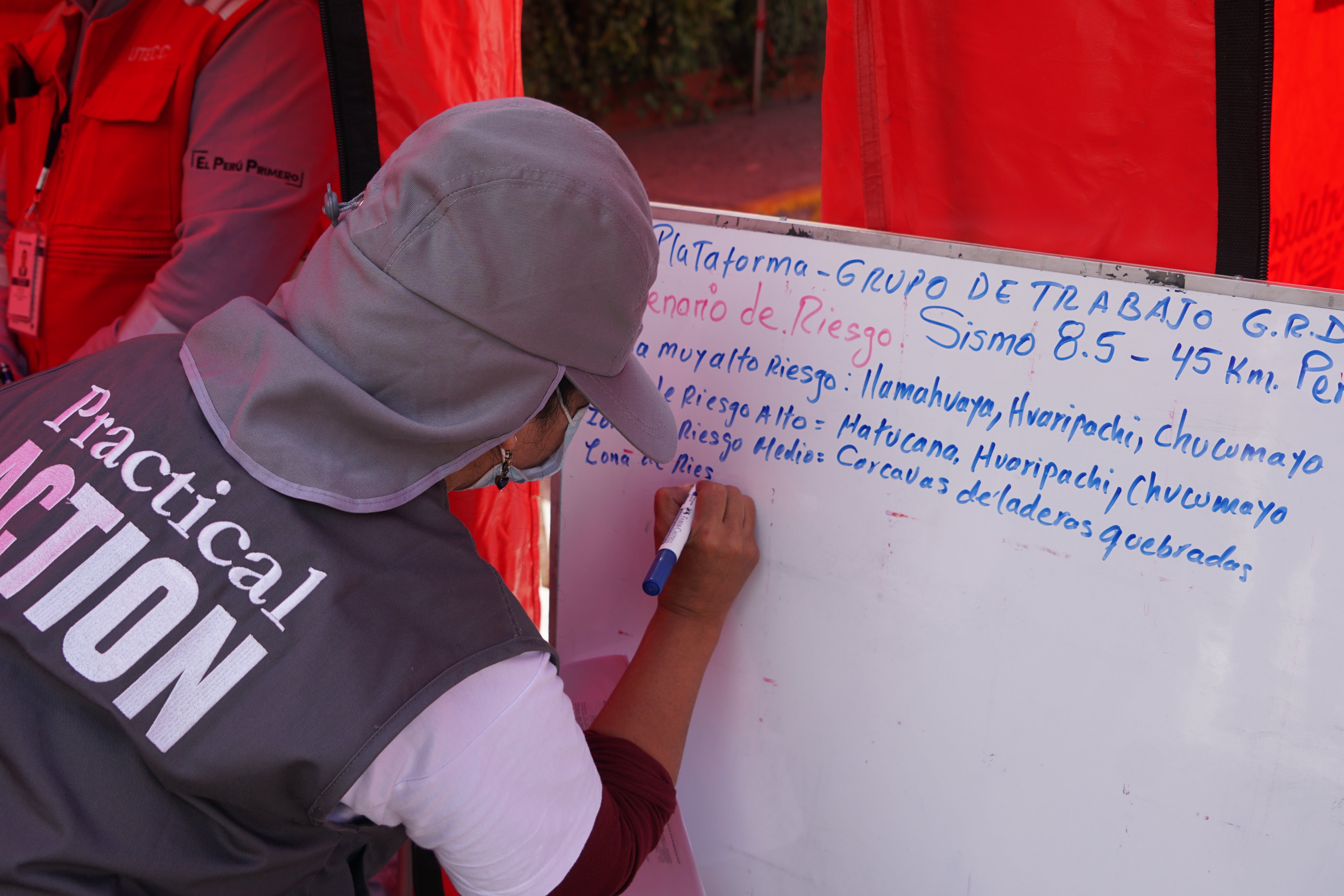 An aid worker assesses the drill