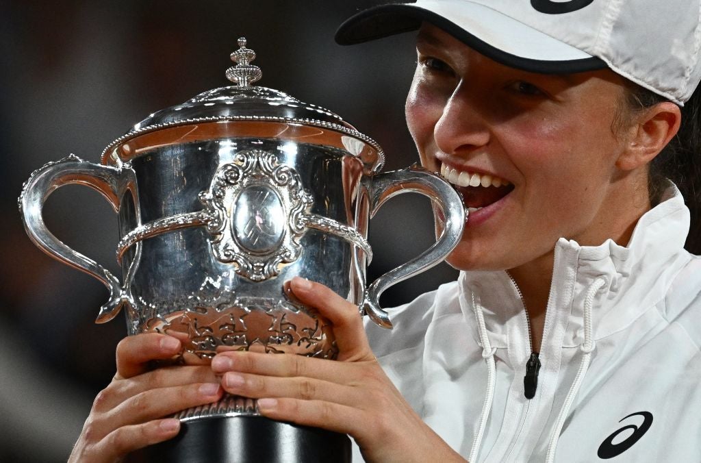 Poland's Iga Swiatek poses with the trophy