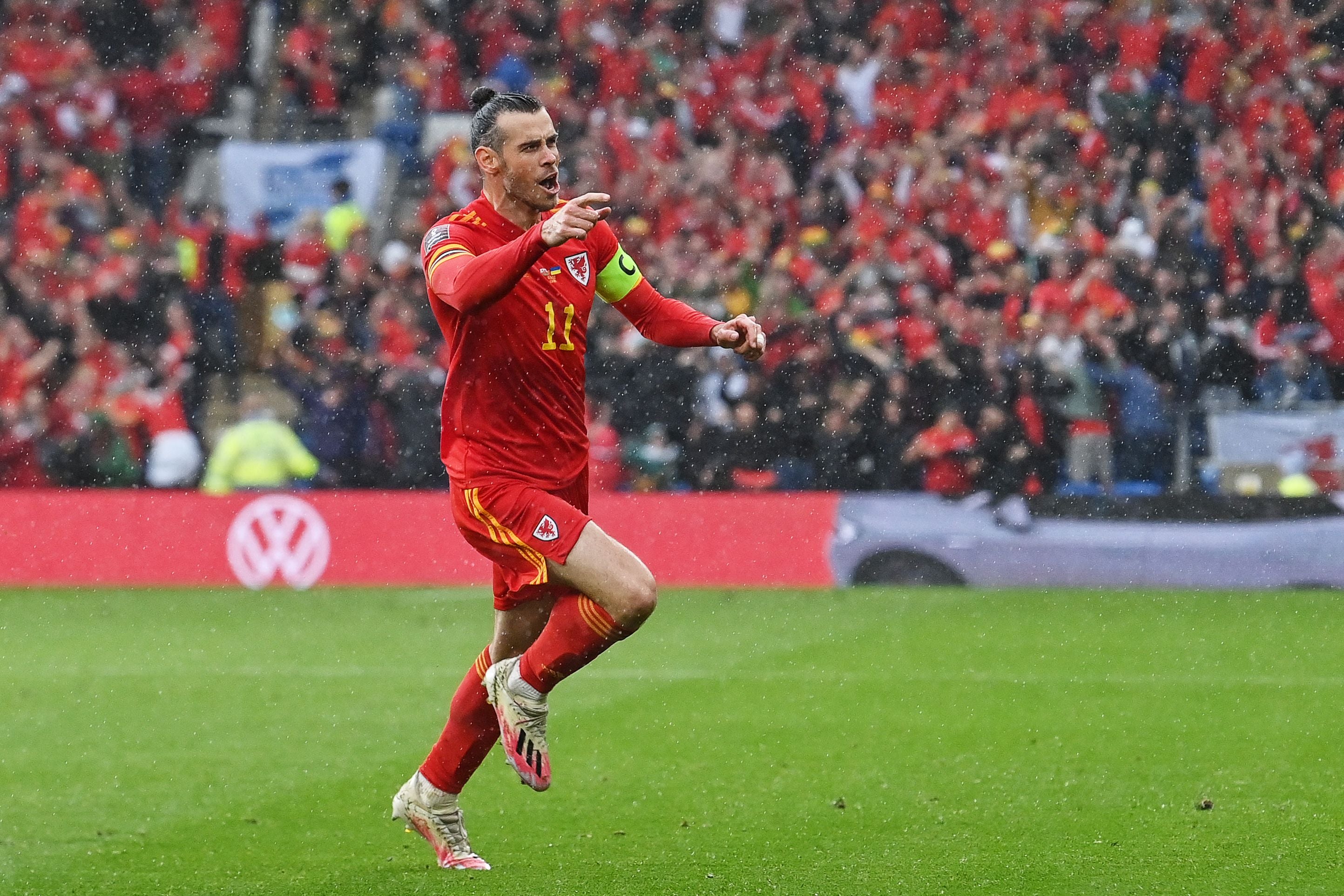 Gareth Bale celebrates after his free-kick is diverted home