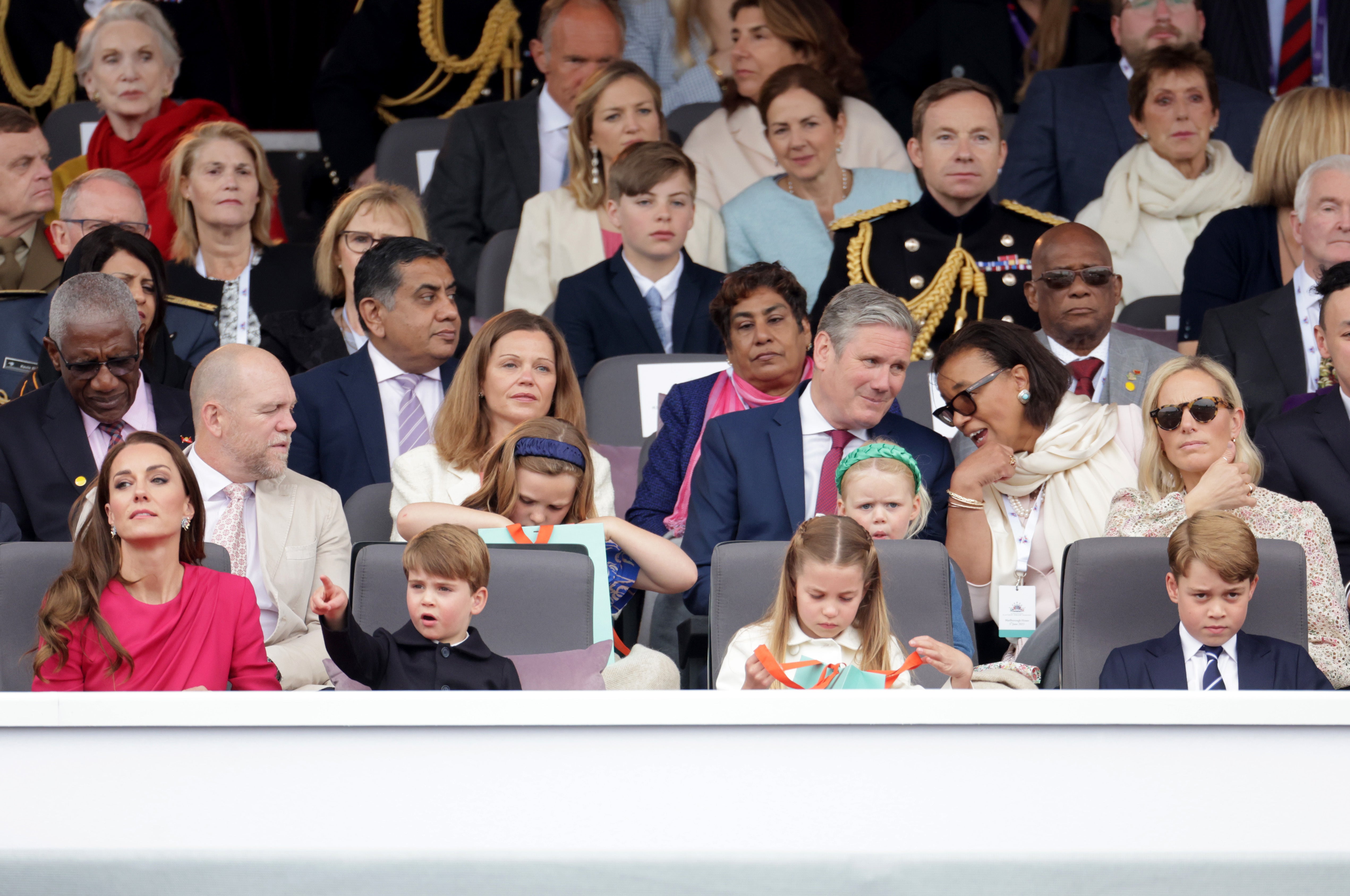 The Duchess of Cambridge, Prince Louis, Princess Charlotte, Prince George, (second row) Mike Tindall, Mia Tindall, Lena Tindall, Zara Tindall, (third row centre) Victoria Starmer and Labour leader Sir Keir Starmer during the Platinum Jubilee Pageant in front of Buckingham Palace (Chris Jackson/PA)