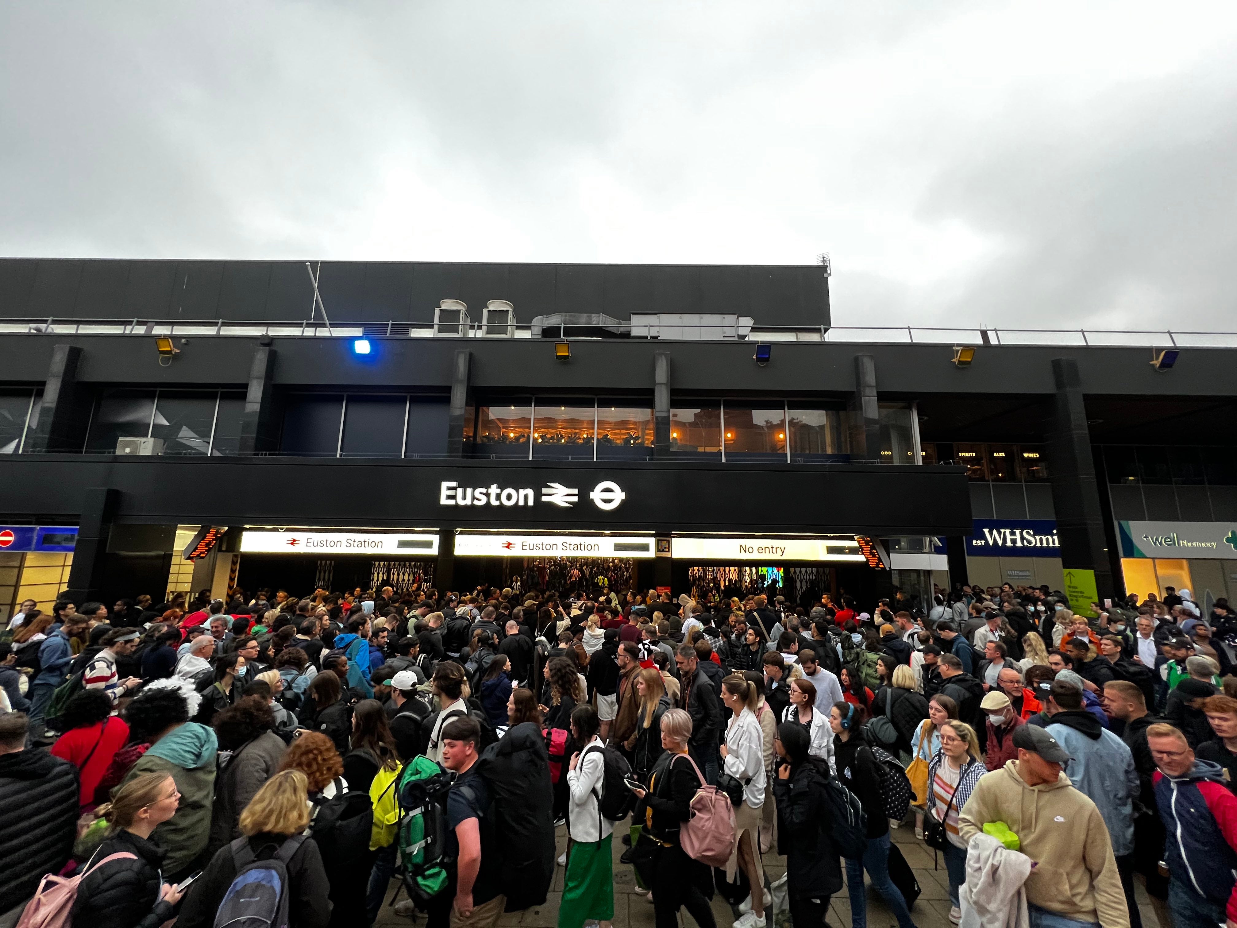 Queues are seen outside London Euston station on Sunday (Joao Souza/PA)