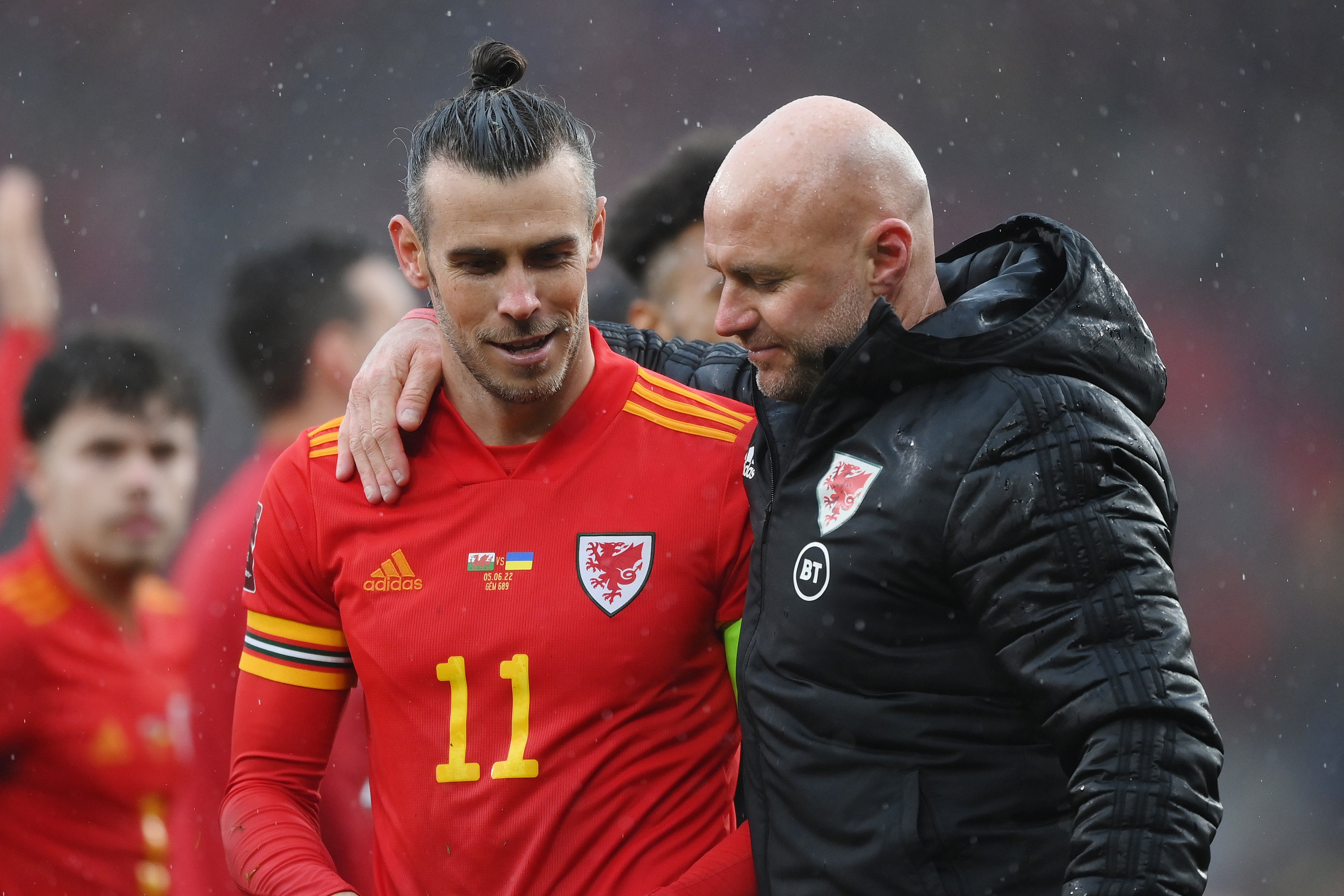 Gareth Bale and Rob Page celebrate their play-off triumph