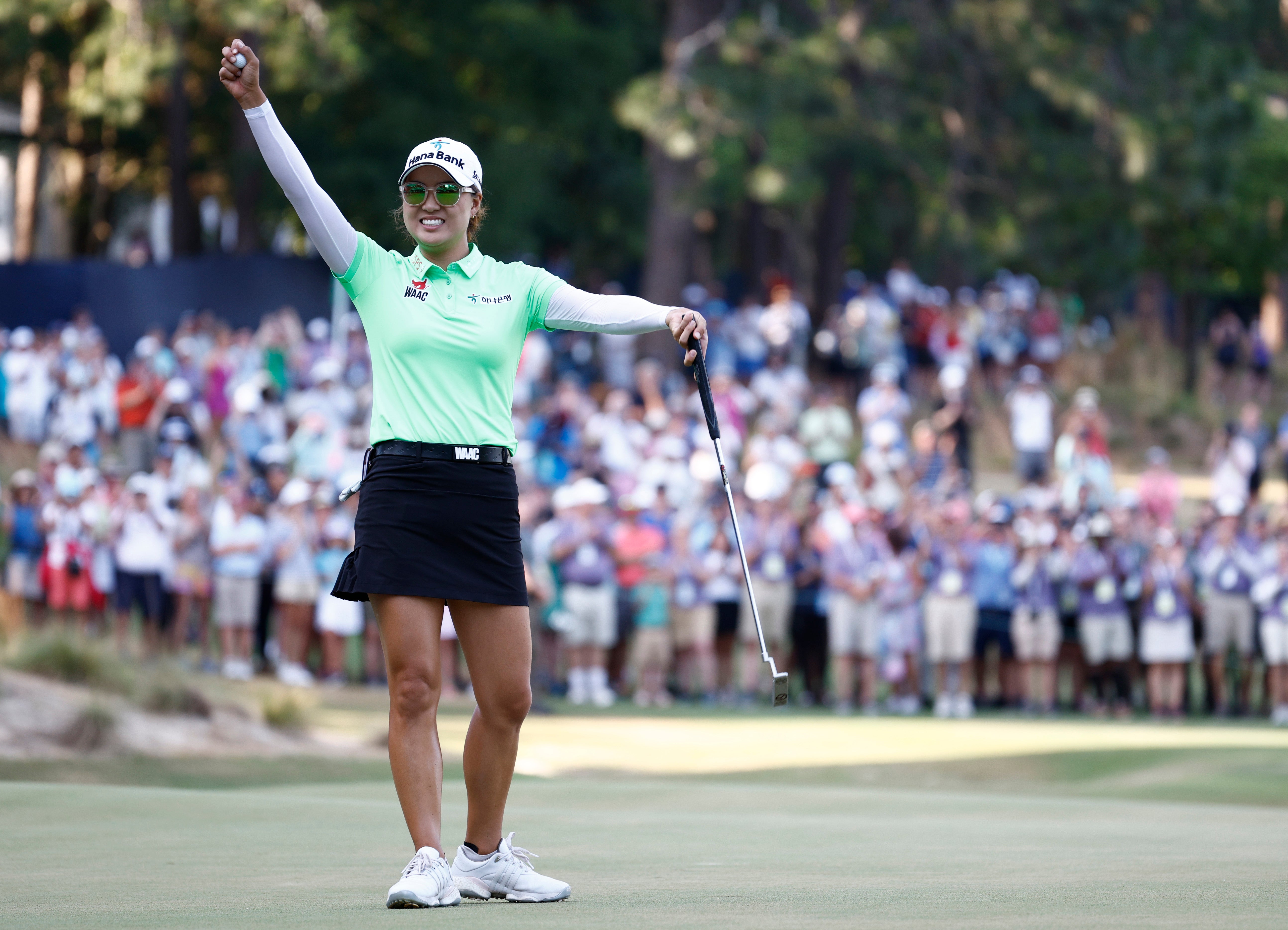 Lee celebrates on the final green