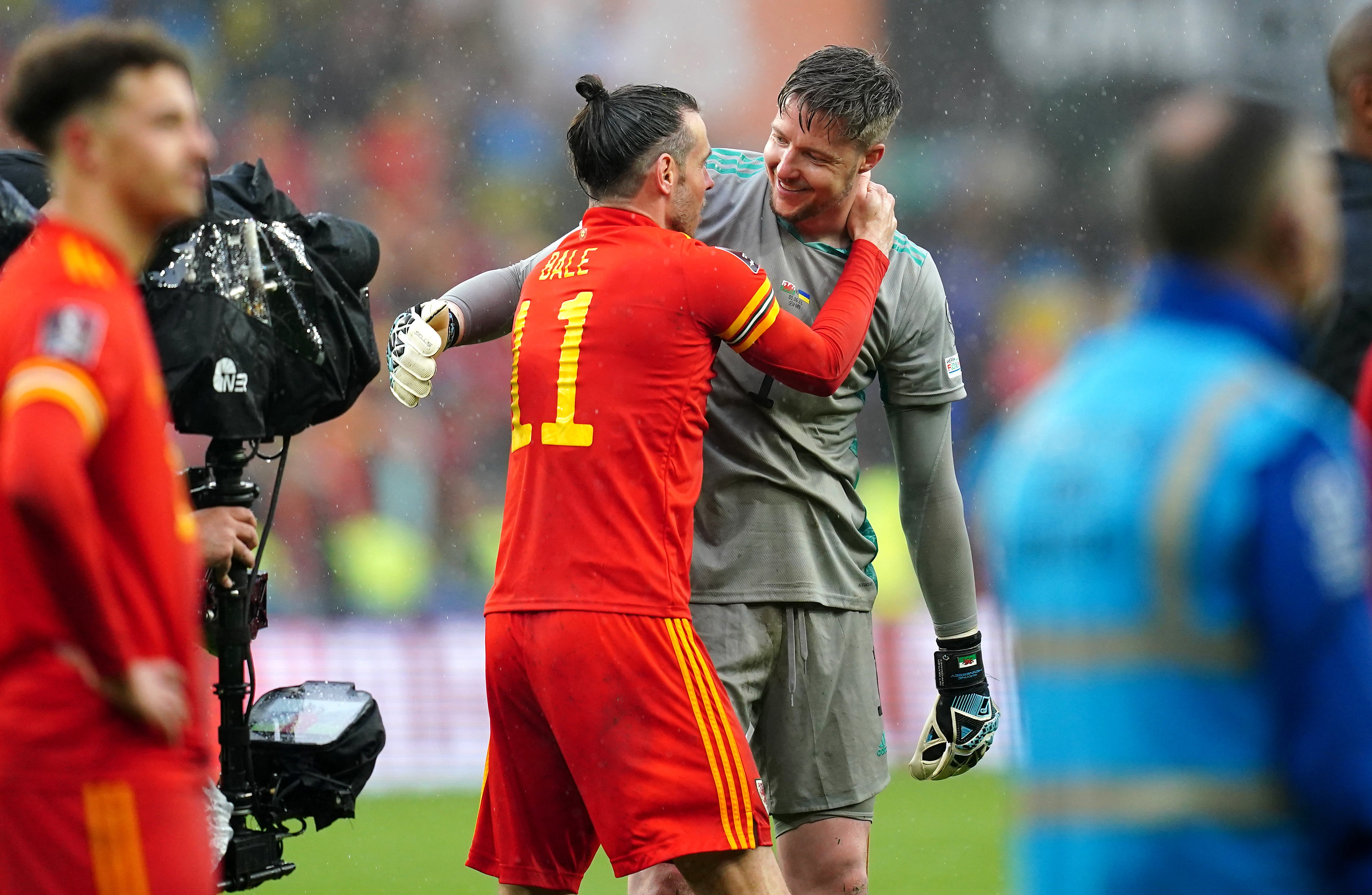 Wayne Hennessey (left) celebrates with Gareth Bale after Wales’ qualification for the 2022 World Cup (David Davies/PA)