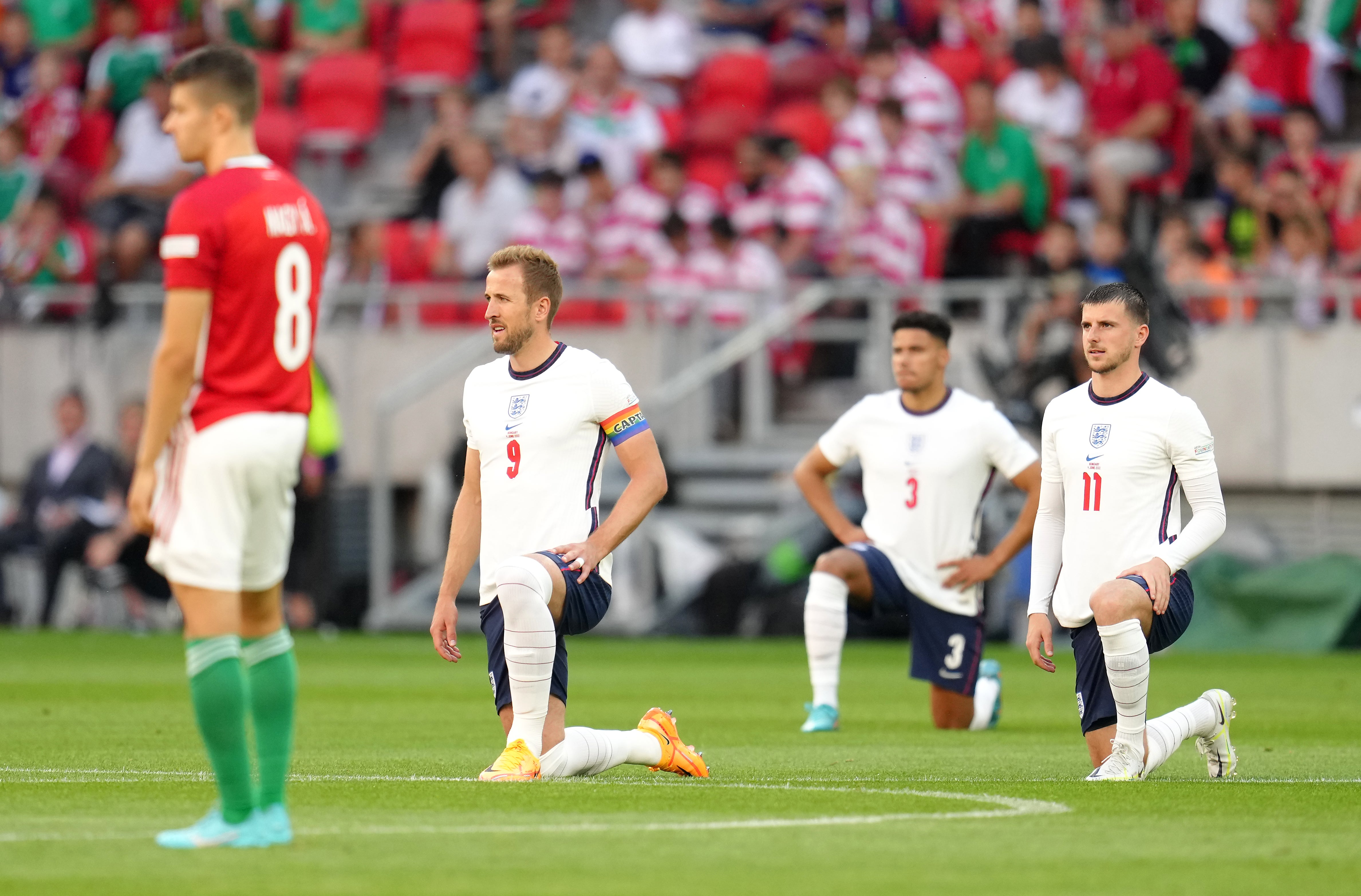 Harry Kane, James Justin and Mason Mount take a knee as Hungary’s Adam Nagy (left) stands (Nick Potts/PA)