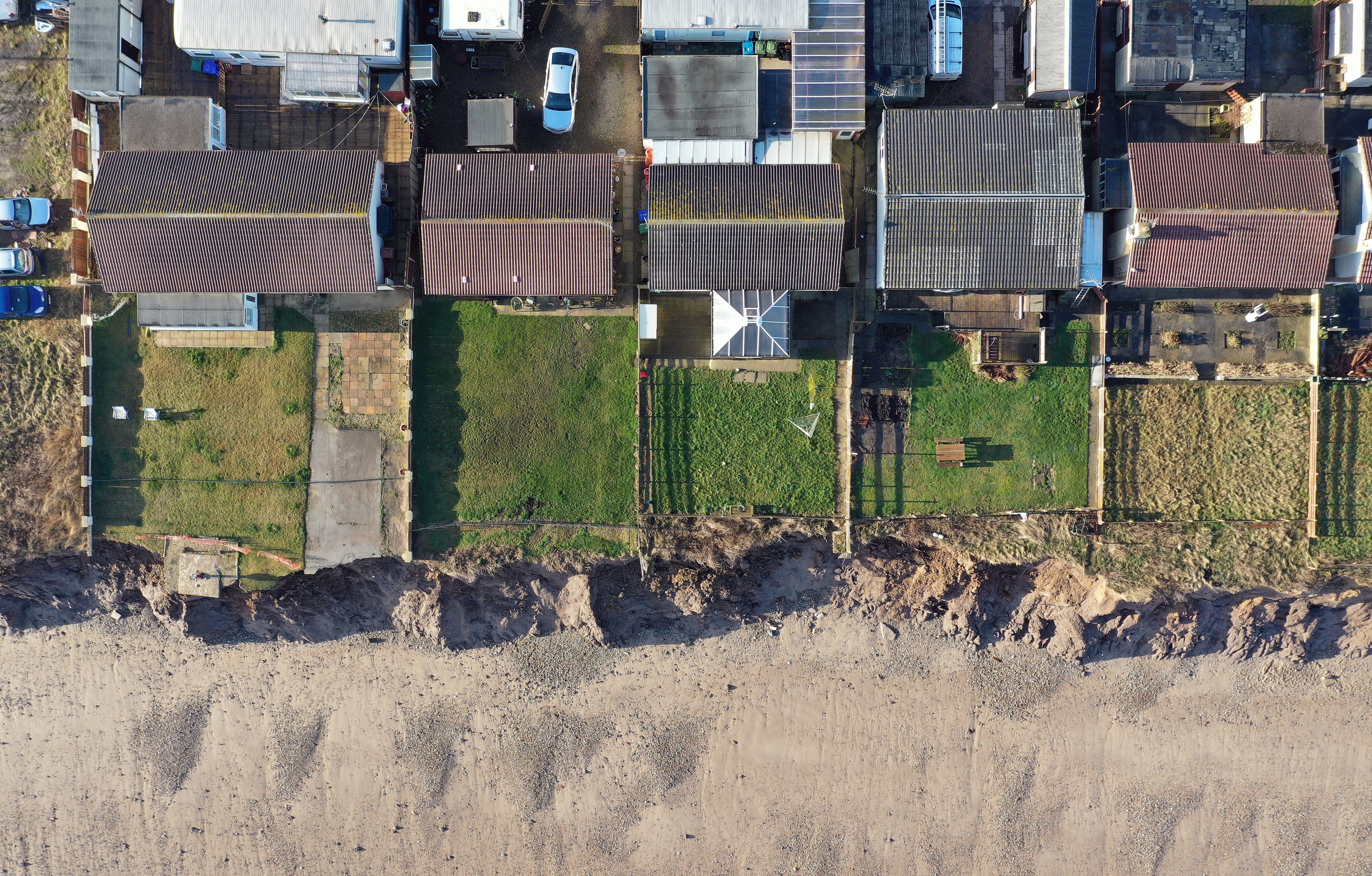 Houses on the coastline in Skipsea, East Yorkshire (PA)