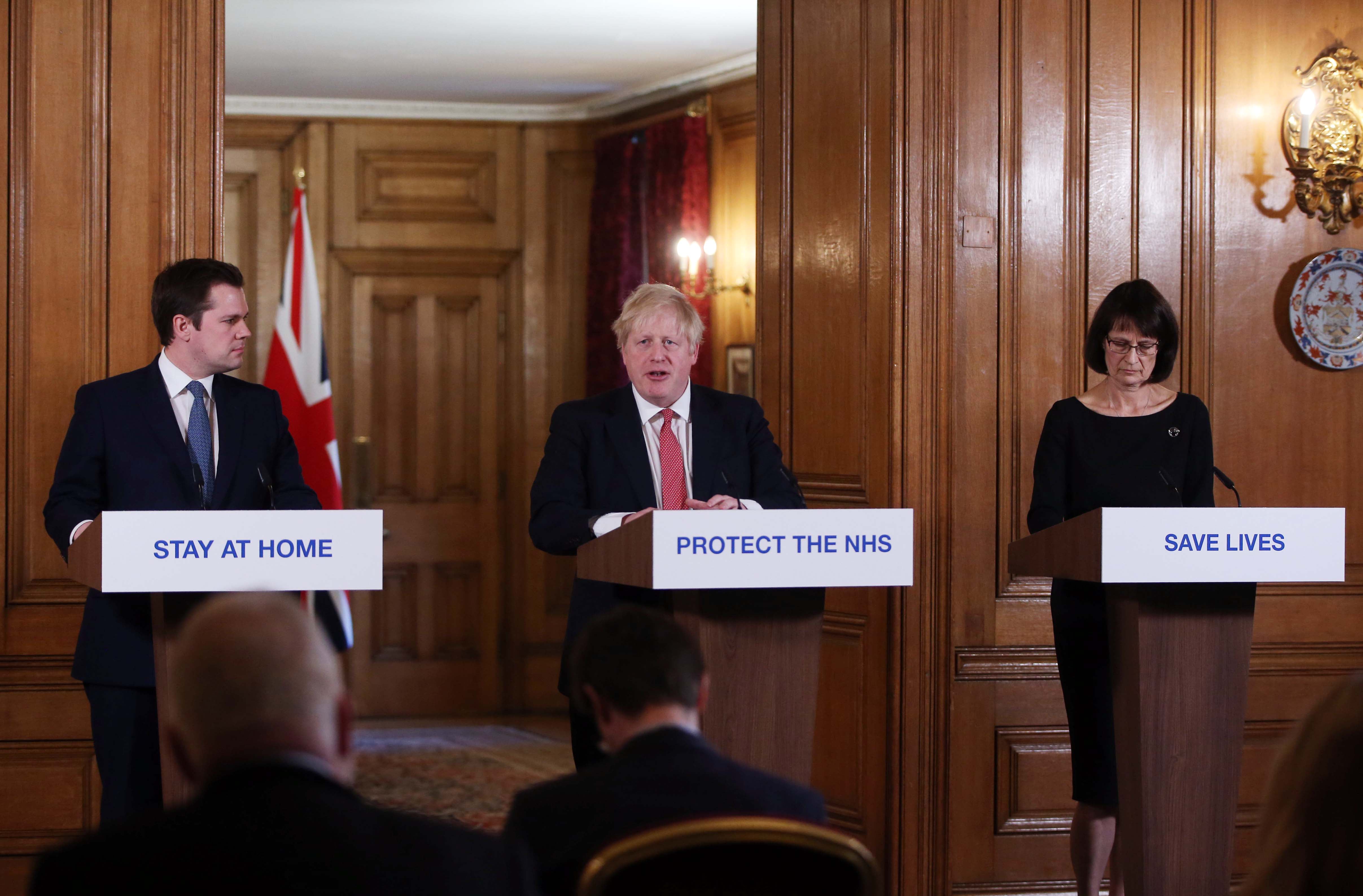 Boris Johnson and the then deputy chief medical officer for England, Jenny Harries, hold a news conference on 22 March 2020