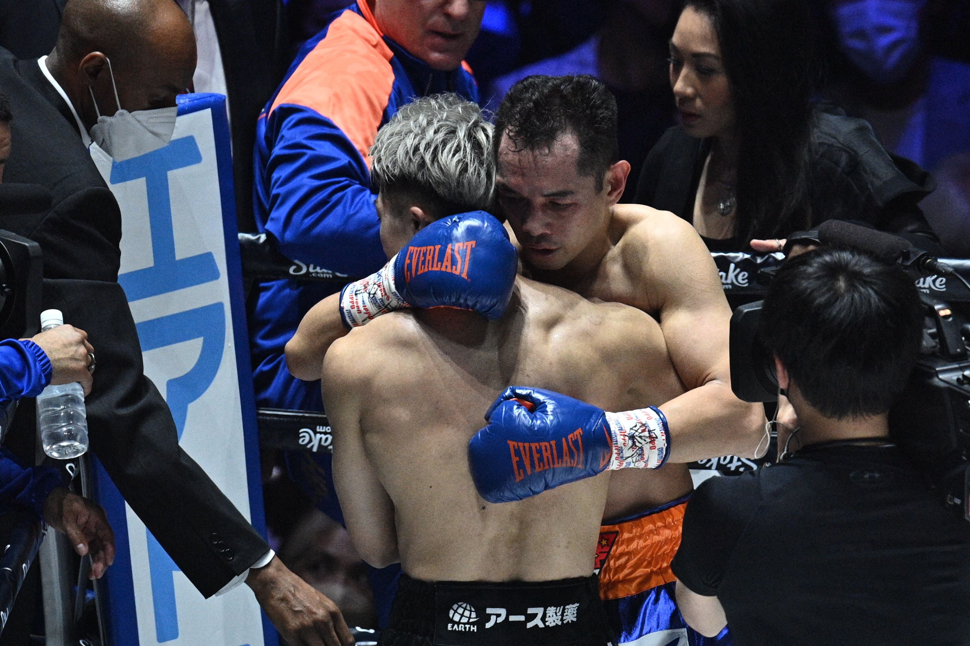 Nonito Donaire (centre-right) congratulates Naoya Inoue on his knockout victory