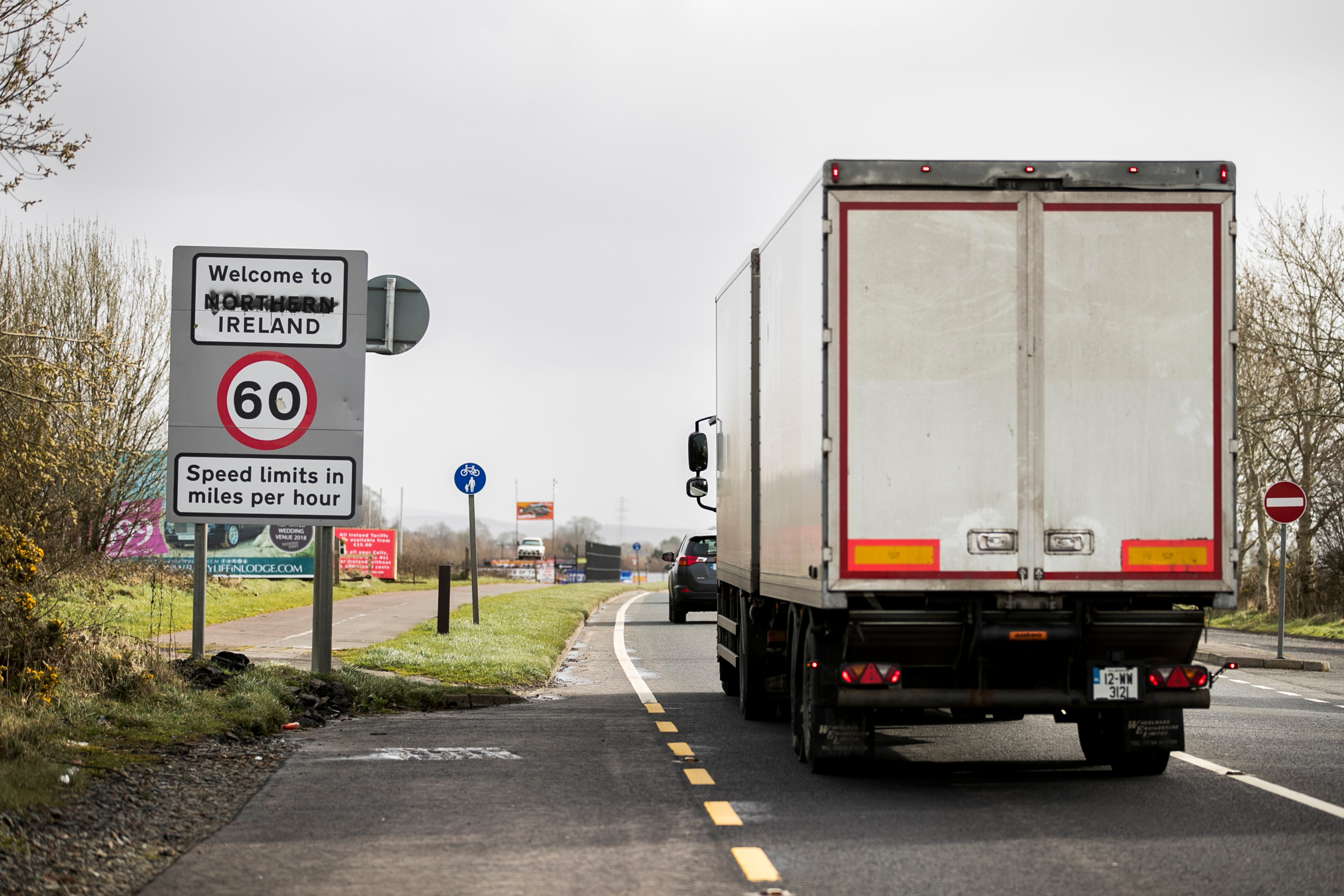 A lorry crosses the border from the Republic of Ireland to Northern Ireland on the Buncrana Road outside Londonderry. (Liam McBurney/PA)