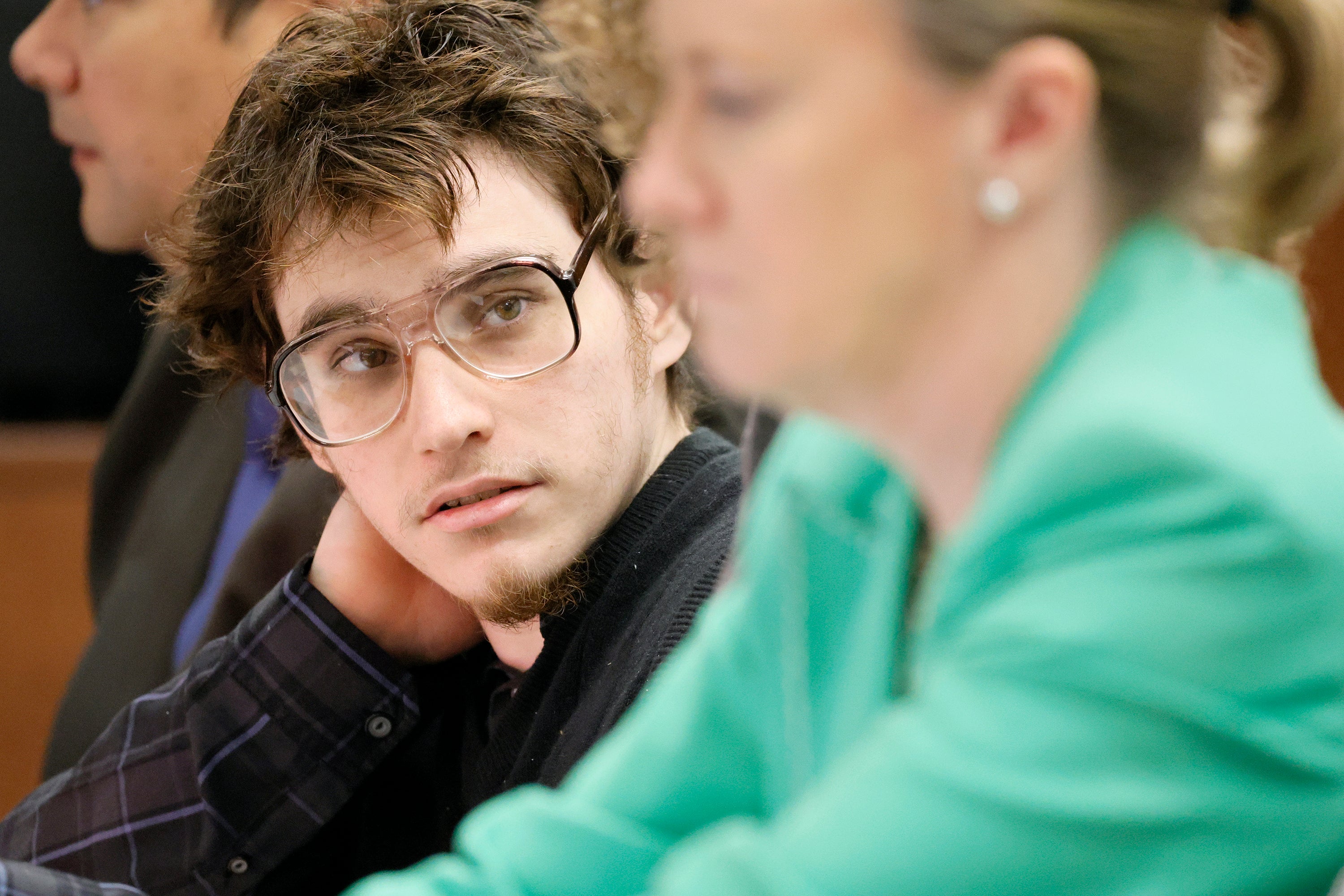 Marjory Stoneman Douglas High School shooter Nikolas Cruz glances at Assistant Public Defender Melisa McNeill during jury selection in the penalty phase of his trial at the Broward County Courthouse in Fort Lauderdale on Monday, June 6, 2022