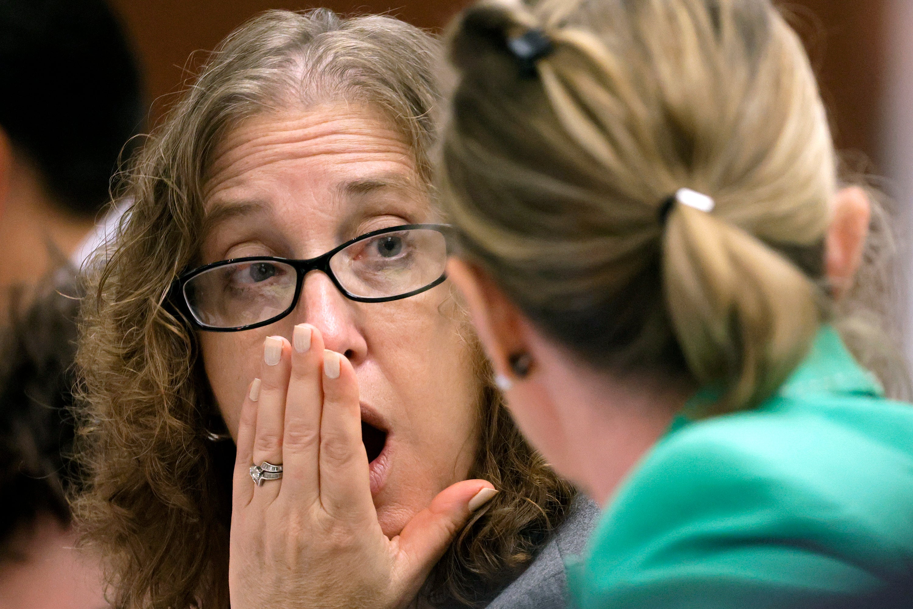 Assistant Public Defender Tamara Curtis, left, reacts to Assistant Public Defender Melisa McNeill during a break in the day's jury selection in the penalty phase of the trial of Marjory Stoneman Douglas High School shooter Nikolas Cruz