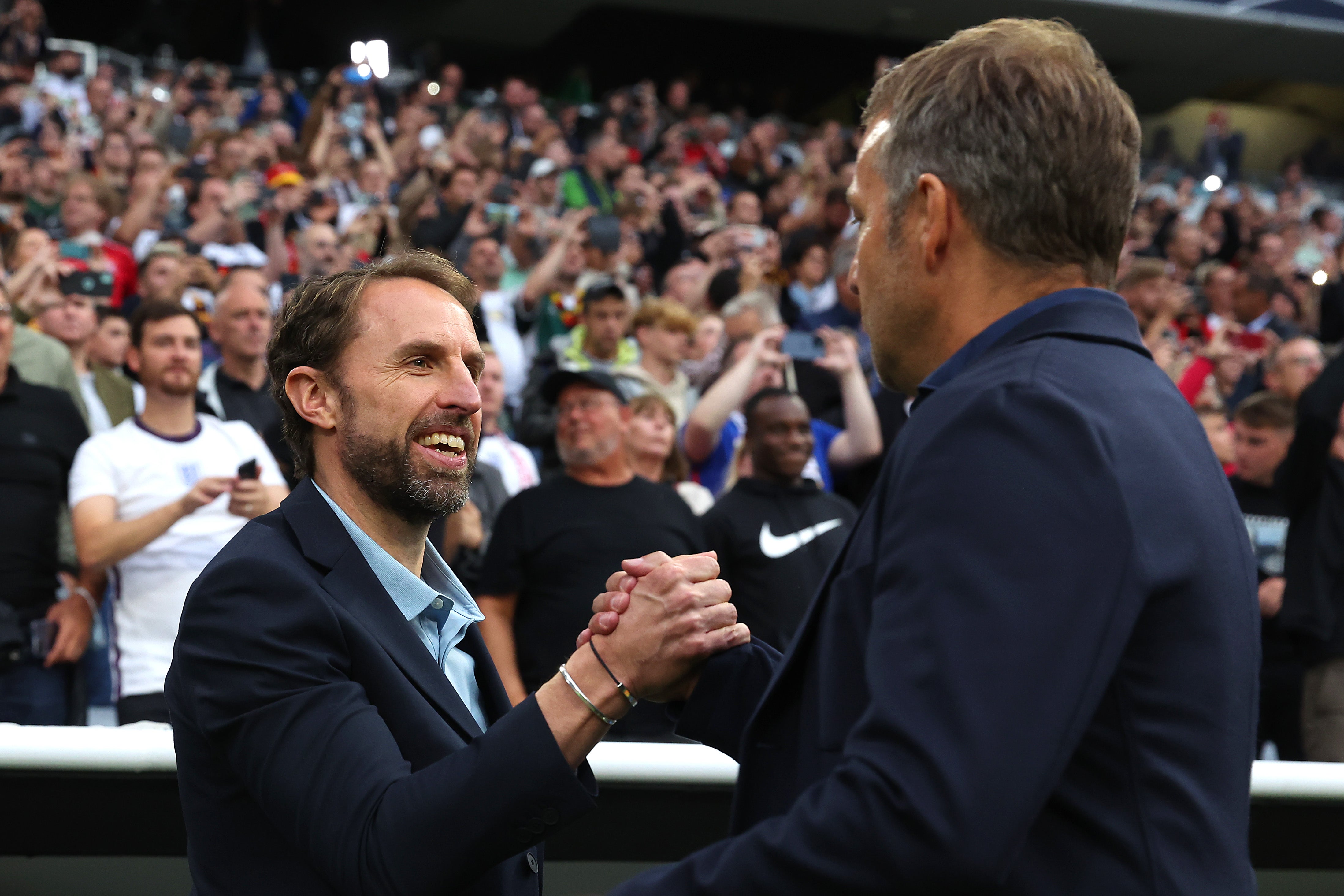 Southgate embraces Flick after their draw in Munich