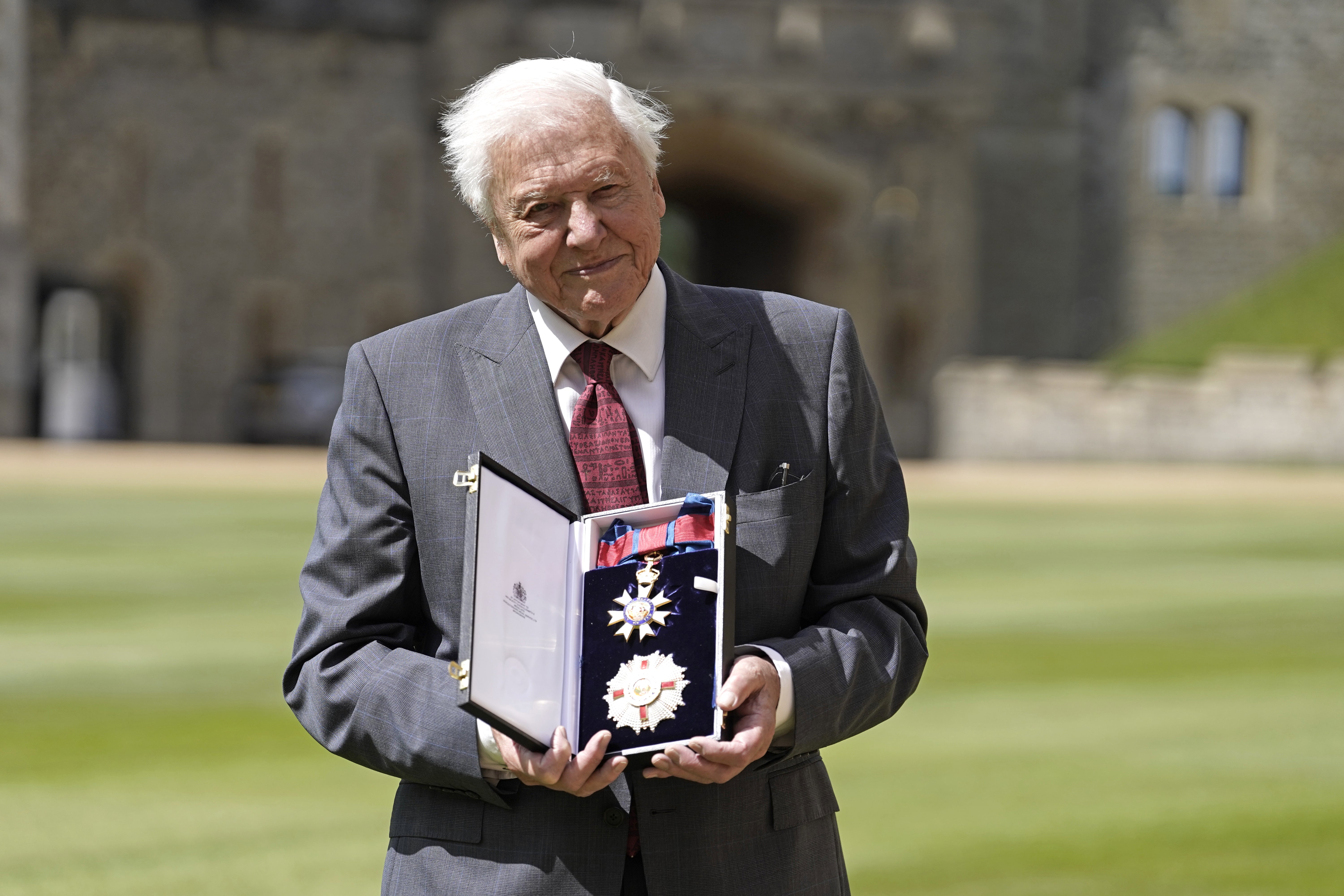 Sir David Attenborough after being appointed a Knight Grand Cross of the Order of St Michael and St George following an investiture ceremony at Windsor Castle (Andrew Matthews/PA)