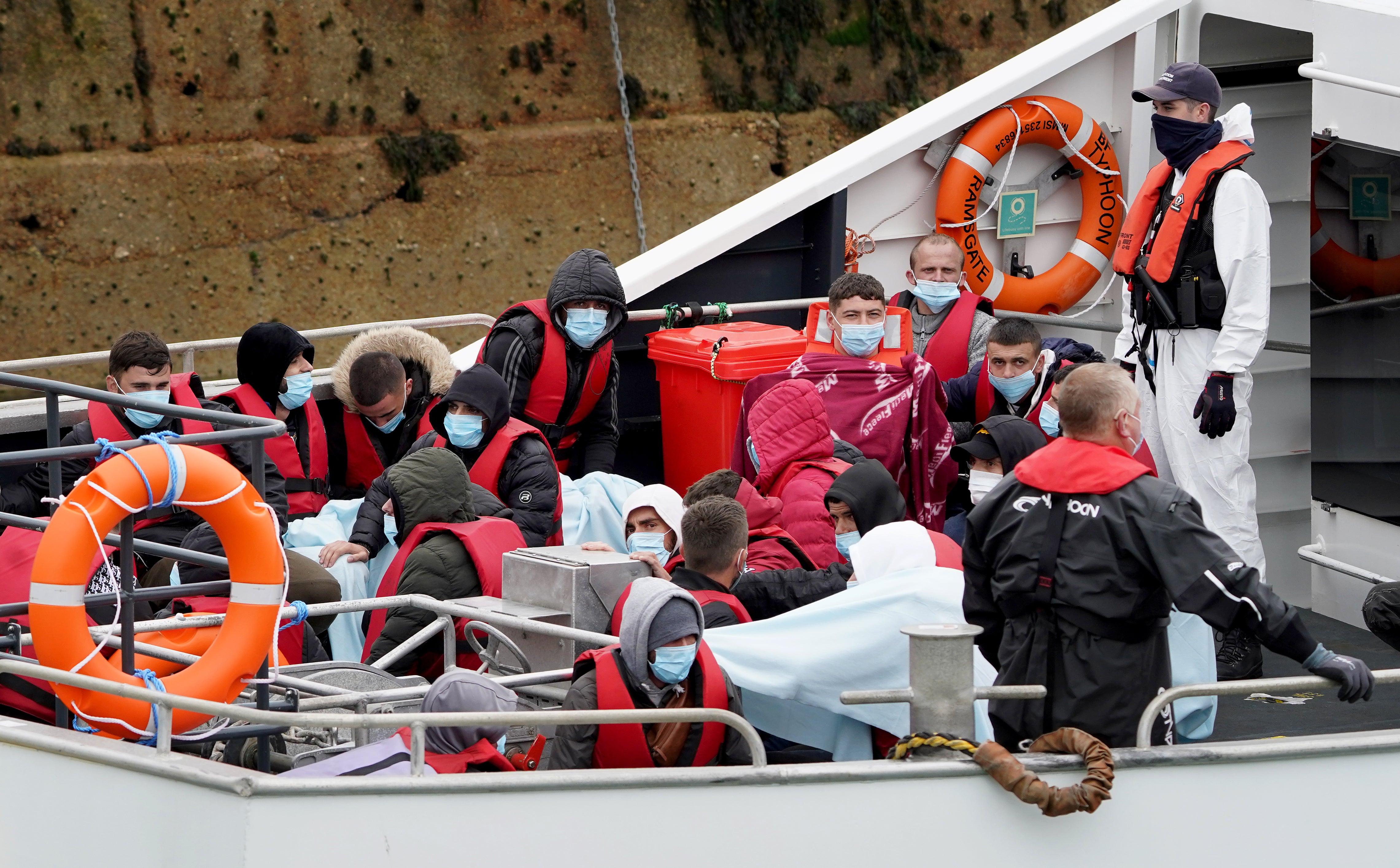 A group thought to be migrants are brought into Dover by Border Patrol on Tuesday following a small boat incident in the Channel