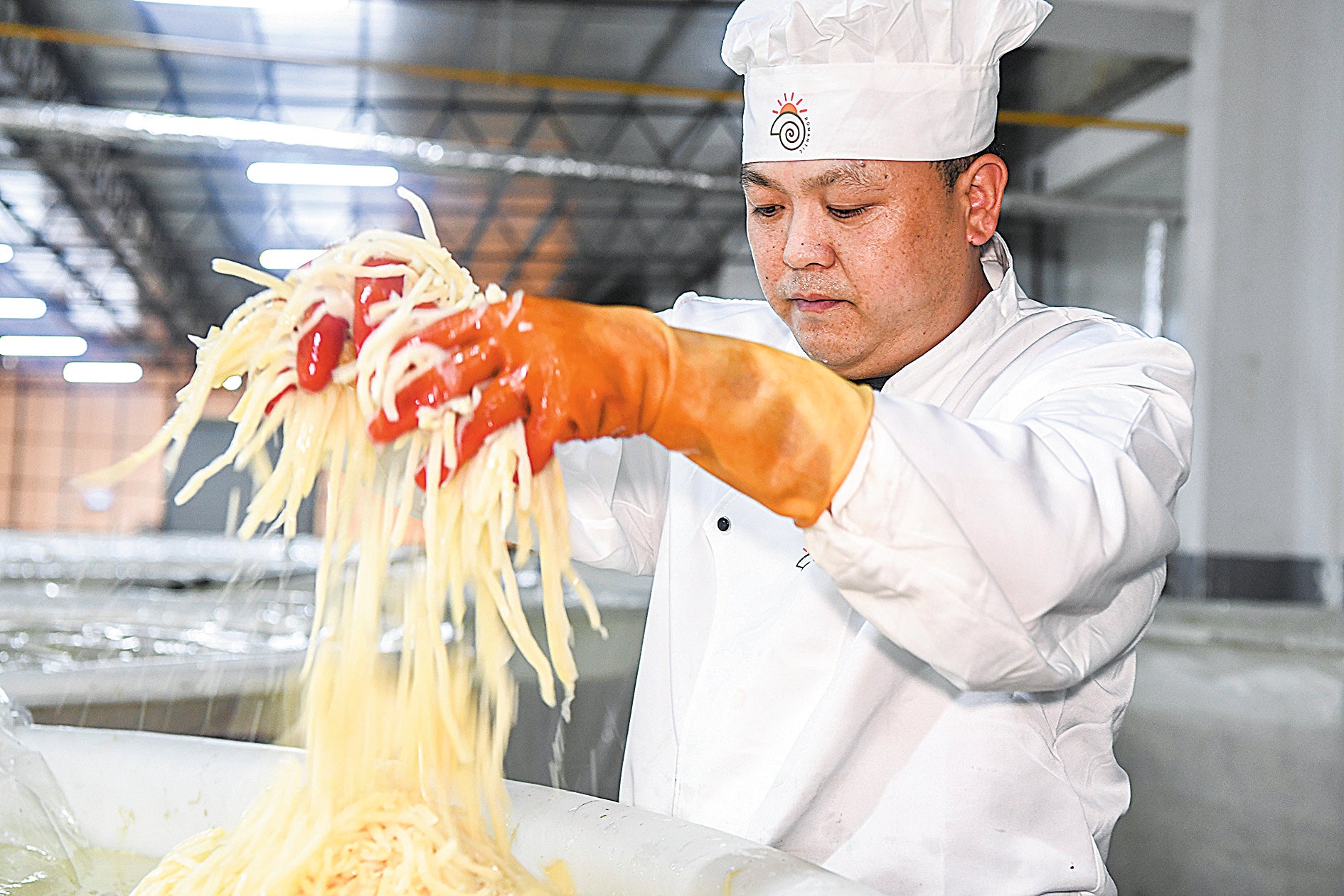 An employee of a luosifen maker checks the status of the pickled bamboo shoots in Liuzhou, Guangxi Zhuang autonomous region