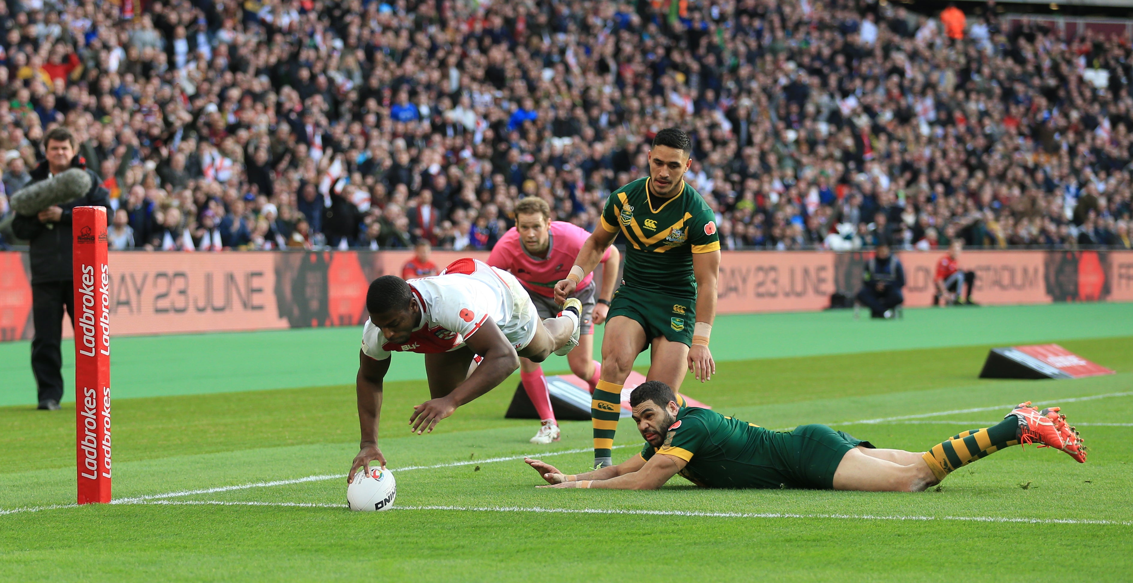 Jermaine McGillvary (left) scores a try against Australia (Nigel French/PA)