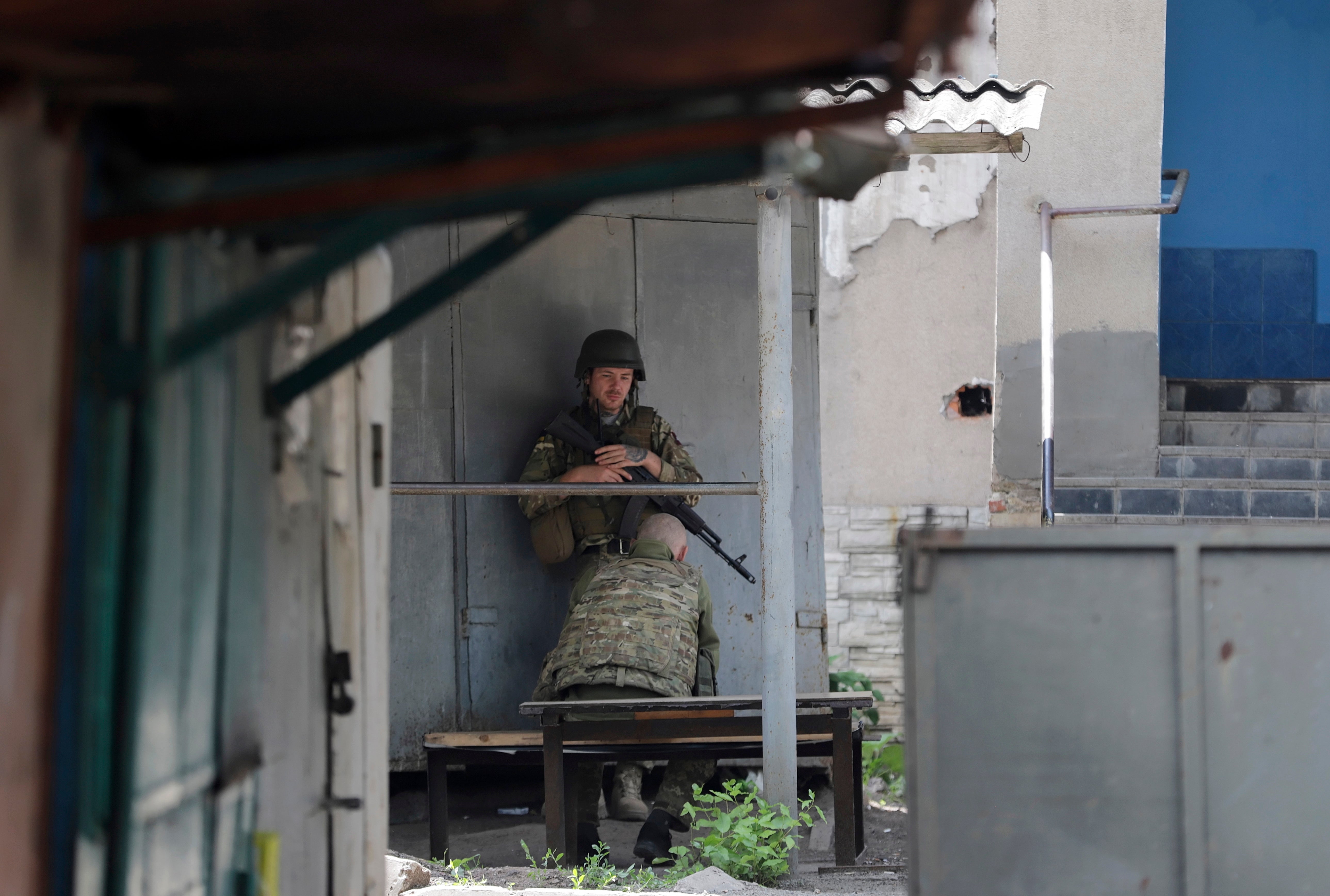 Ukrainian servicemen rest while patrolling in Donetsk, eastern Ukraine