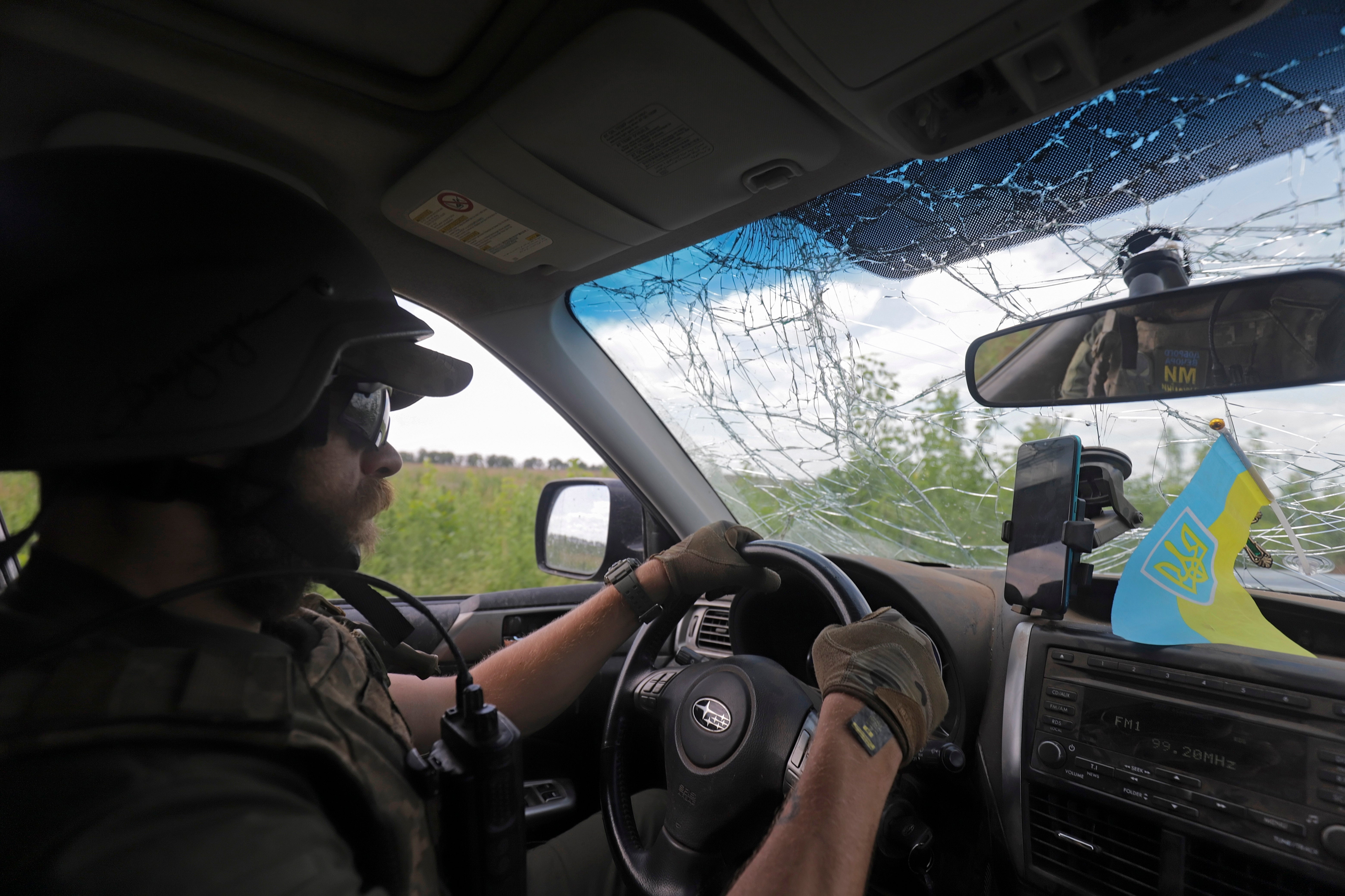 A Ukrainian serviceman driving in Donetsk on Wednesday