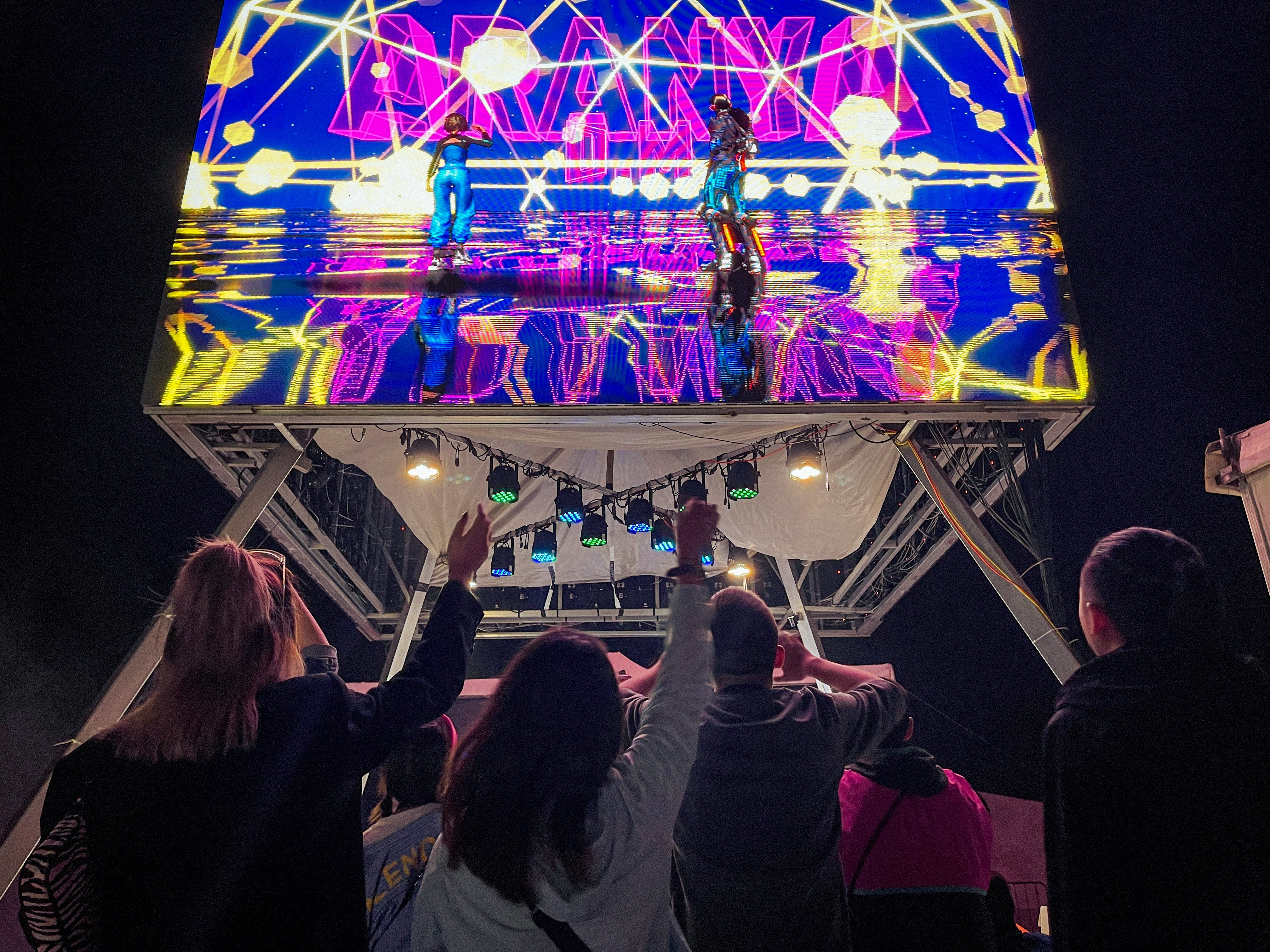 Virtual band D.M performs for an audience at an arts festival which attracts about 300 artists in Qinhuangdao, Hebei province, in June 2021