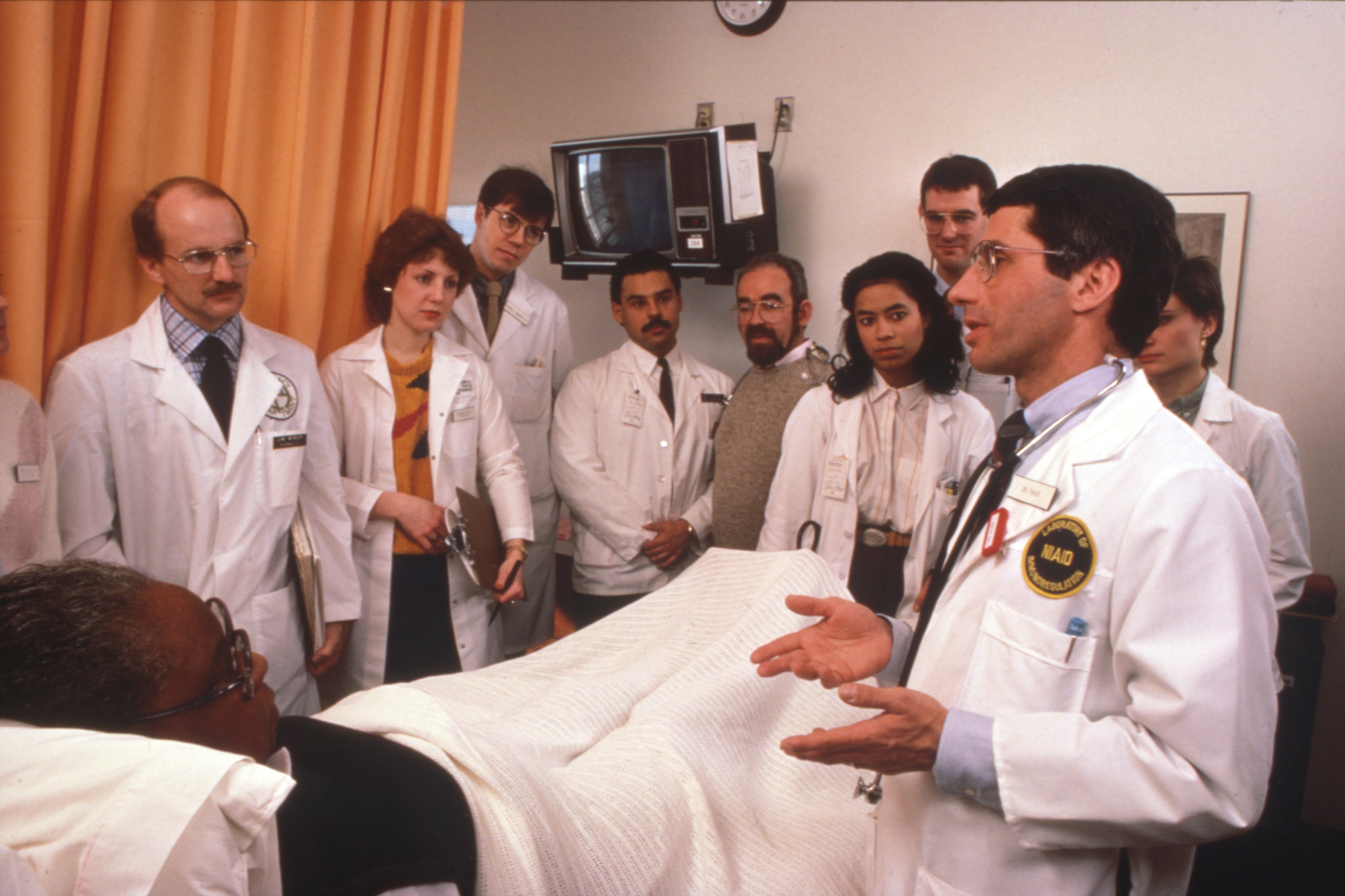 Dr Fauci and treatment team with an early Aids patient at NIH during medical rounds, circa 1986