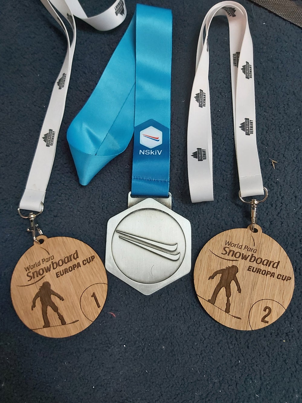 Three of Nina’s medals from Para snowboarding (Collect/PA Real Life)