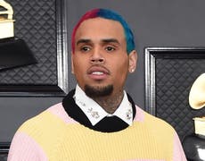 Chris Brown defends taking risqué photos with fans at concert meet-and-greets