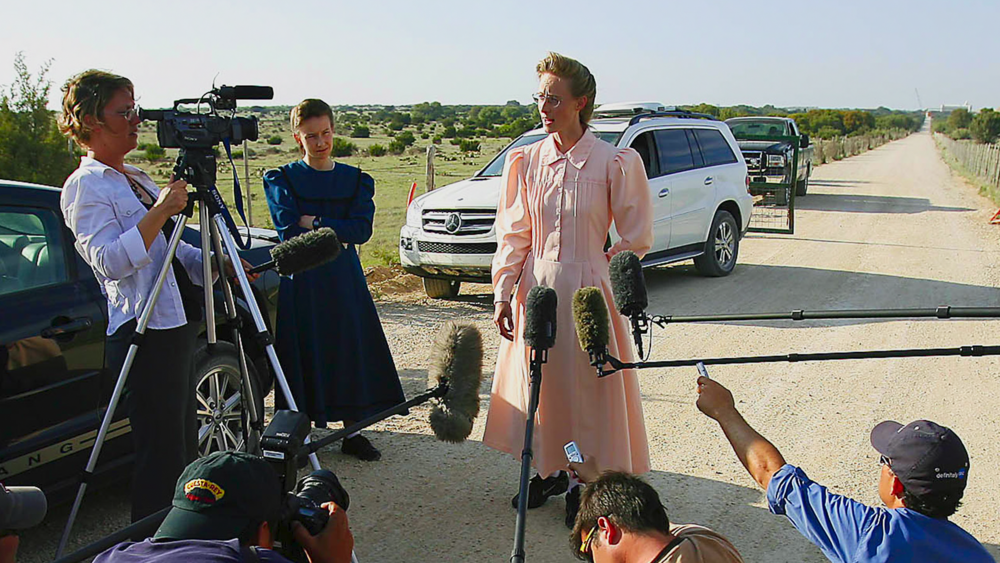 A woman from the FLDS speaks to the media after a 2008 police raid of an FLDS ranch