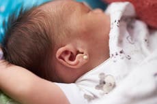Mom sparks backlash for piercing newborn’s ears in hospital: ‘How is that even legal?’