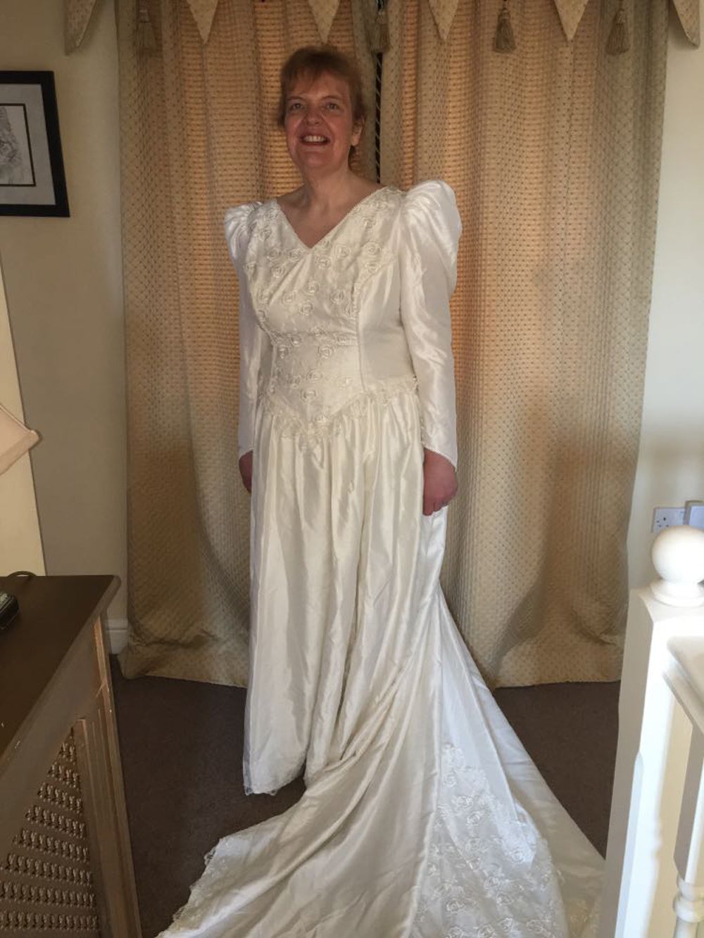 Rachel Mellor wearing her 28 year old size 20 wedding dress (Collect/PA Real Life)