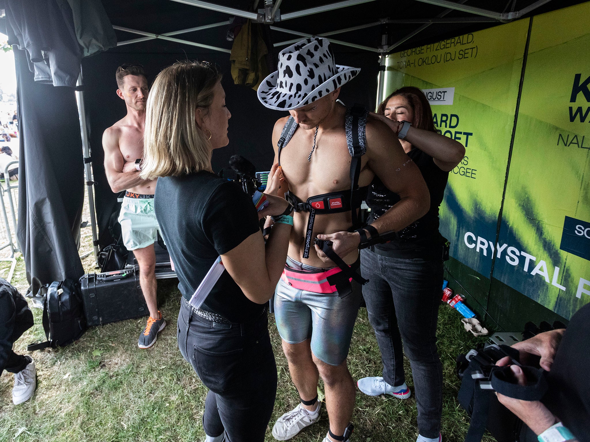 A Mighty Hoopla attendee is strapped into the suit on site