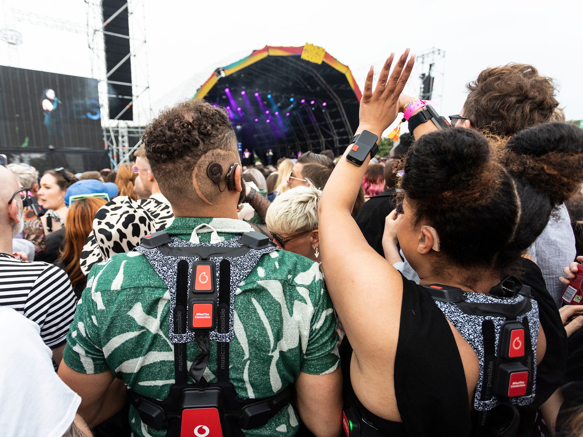 Concertgoers wear the haptic suit at Mighty Hoopla