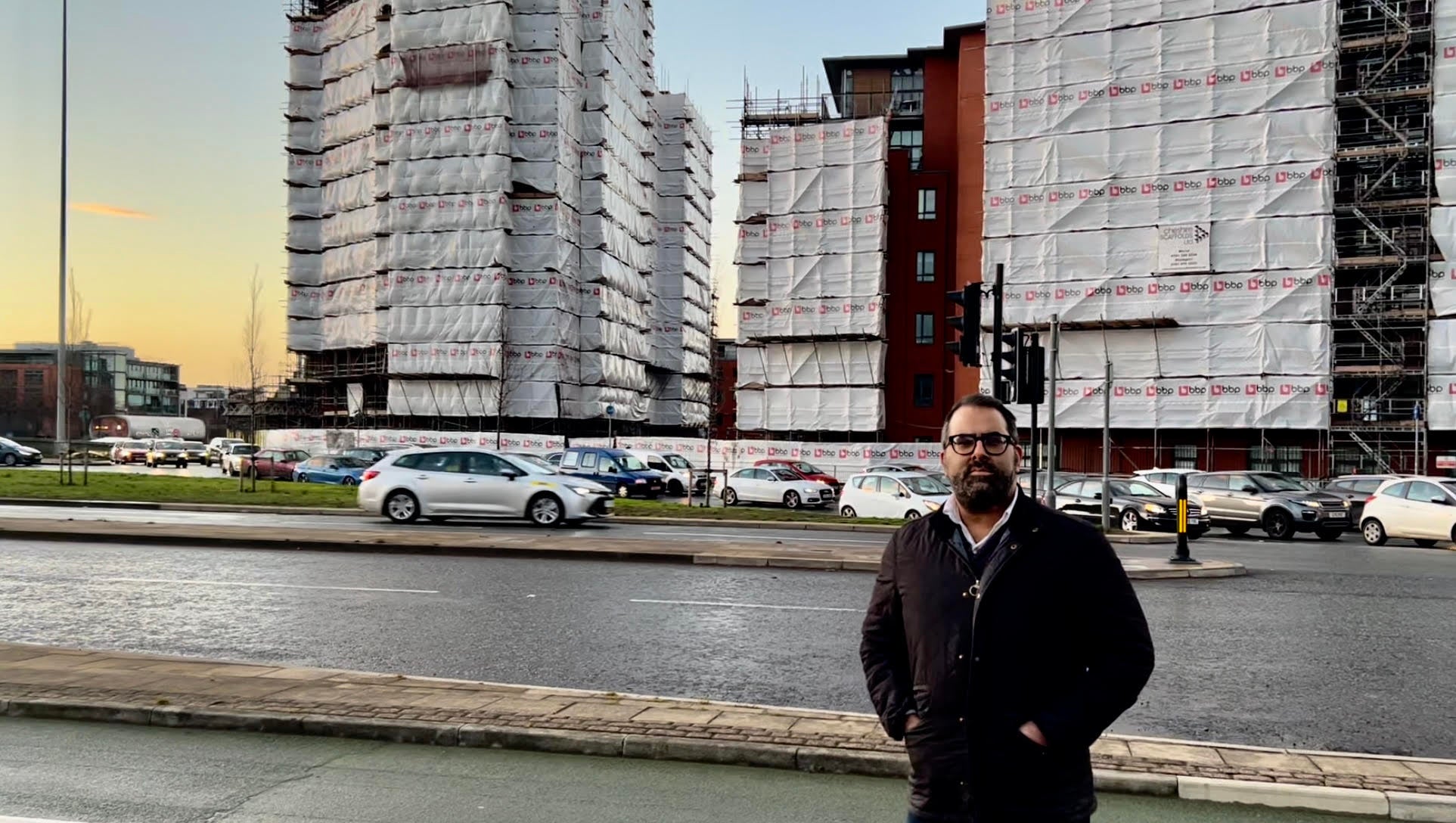 Giles Grover’s apartment building, City Gate in Manchester, has been covered in plastic sheeting for months