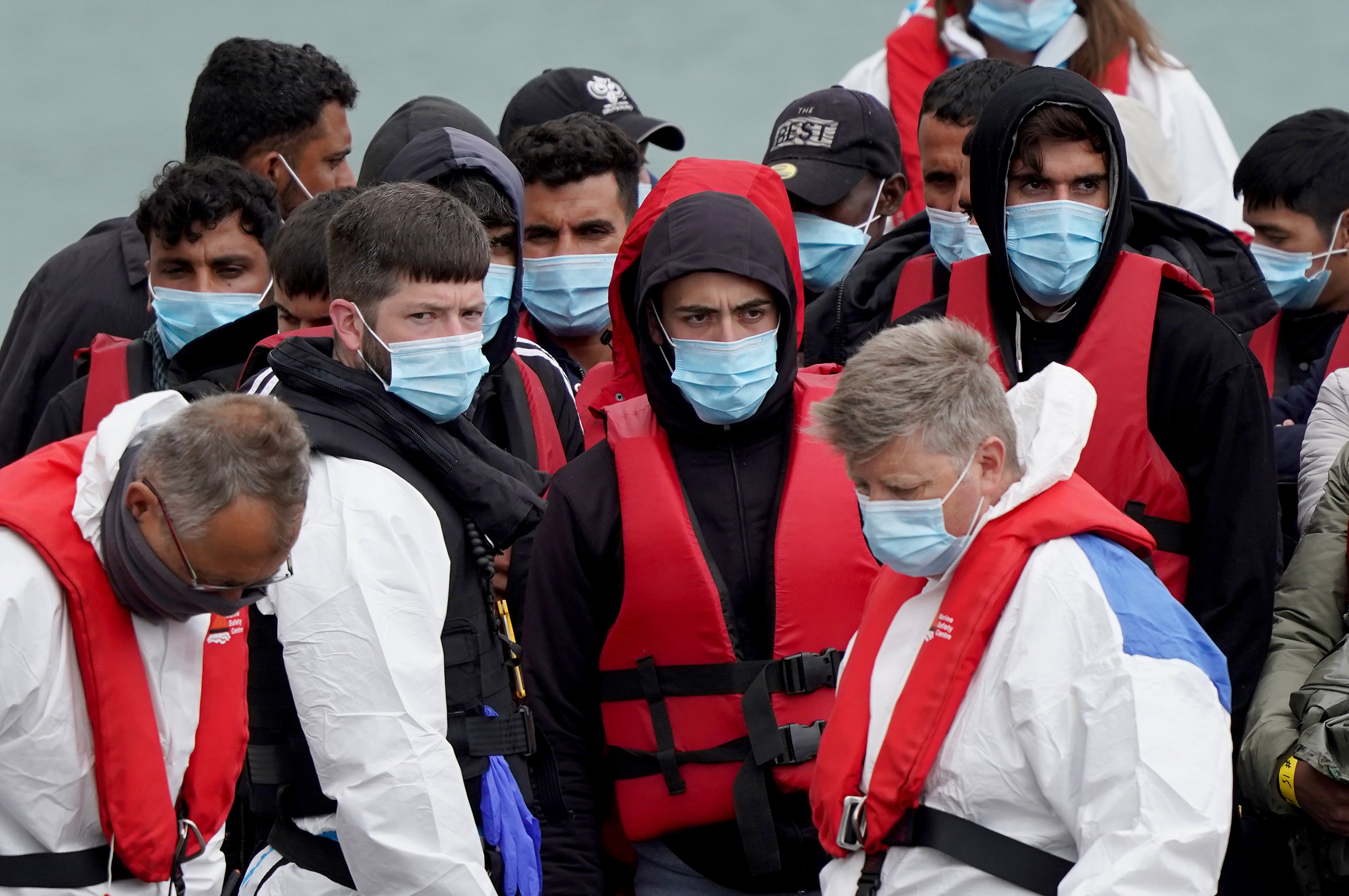 A group of people thought to be migrants are brought in to Dover (Gareth Fuller/PA)