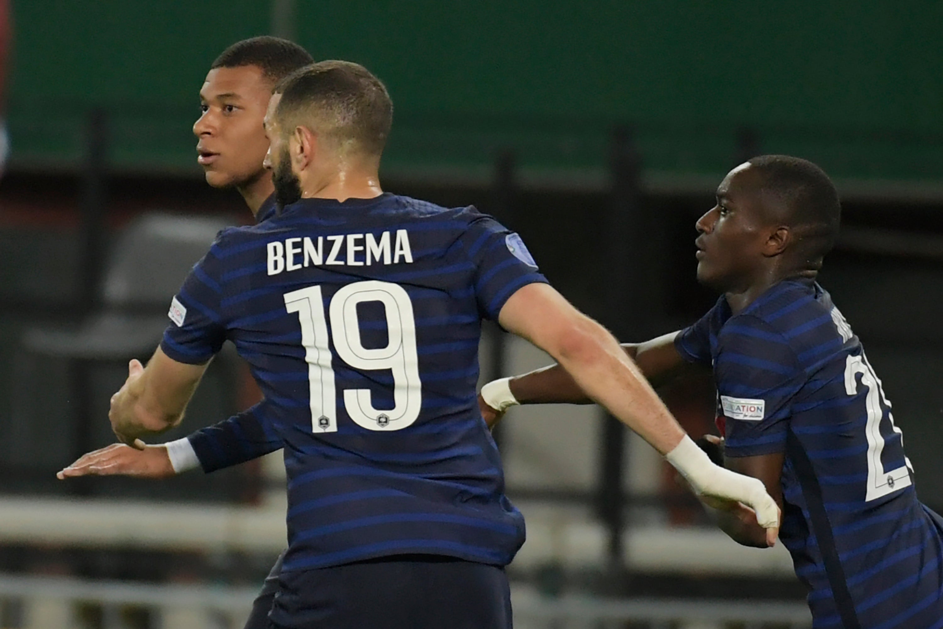 Kylian Mbappe, left, rescued a point for France (Michael Gruber/AP)